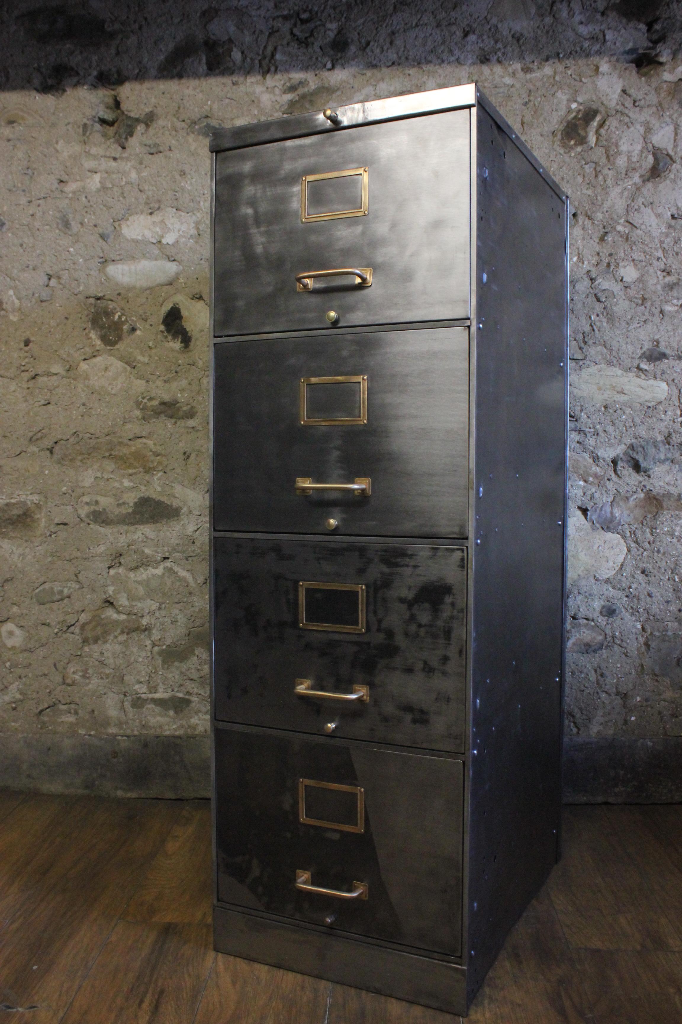 A vintage industrial 1930s American stripped metal 4-drawer filing cabinet. It has solid brass fittings and was manufactured by Art Metal, Jamestown New York. It has been stripped back to bare metal on all sides and is in good solid condition and