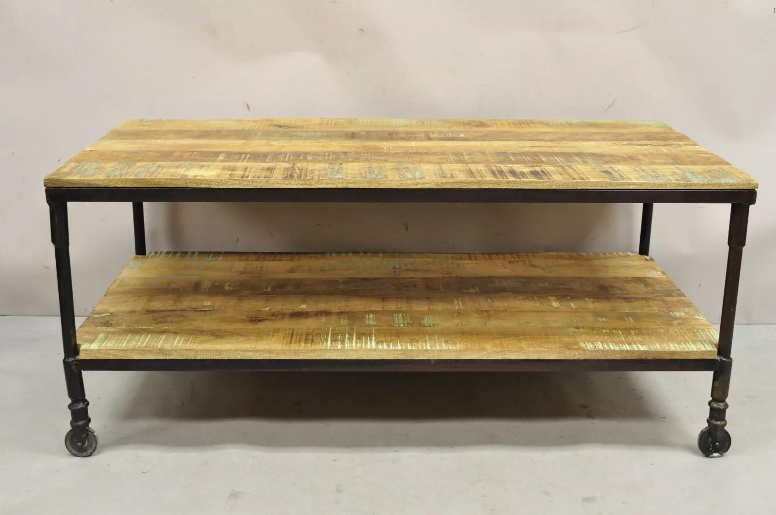Vintage Industrial Style Cast Iron and Distressed Reclaimed Wood Coffee Table with Green Distressed Finish. Circa Late 20th Century. Measurements: 21
