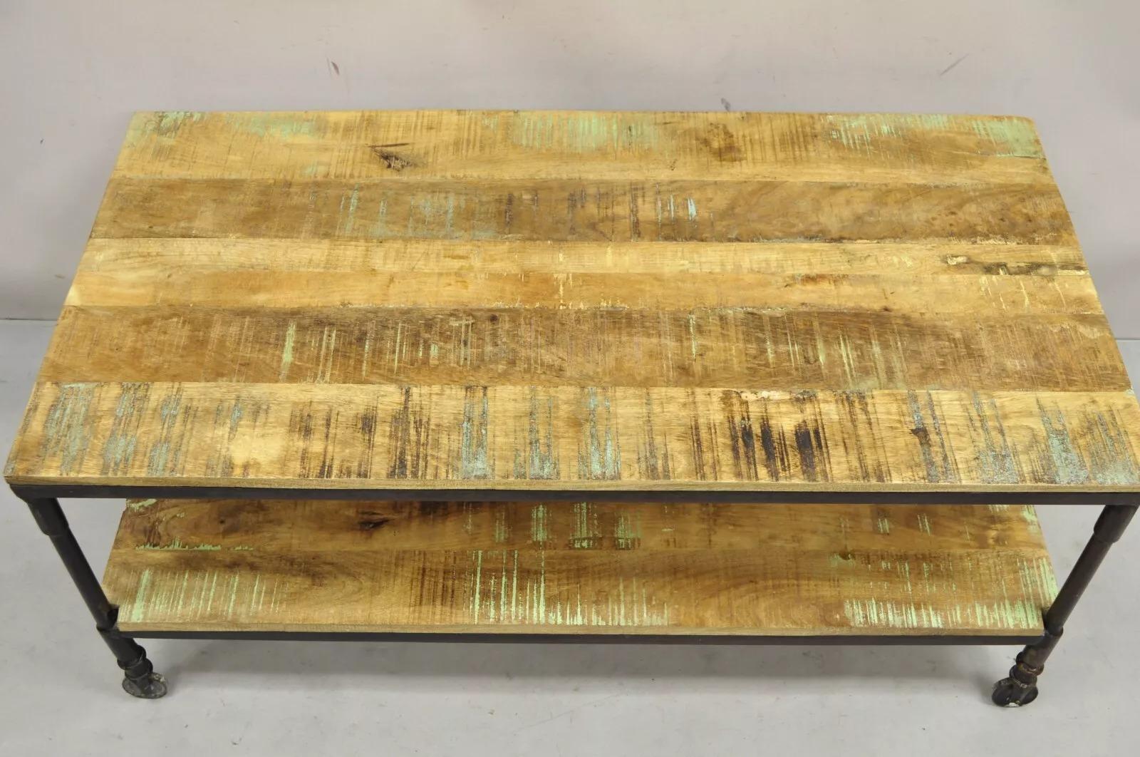 Vintage Industrial Style Cast Iron and Distressed Reclaimed Wood Coffee Table In Good Condition For Sale In Philadelphia, PA