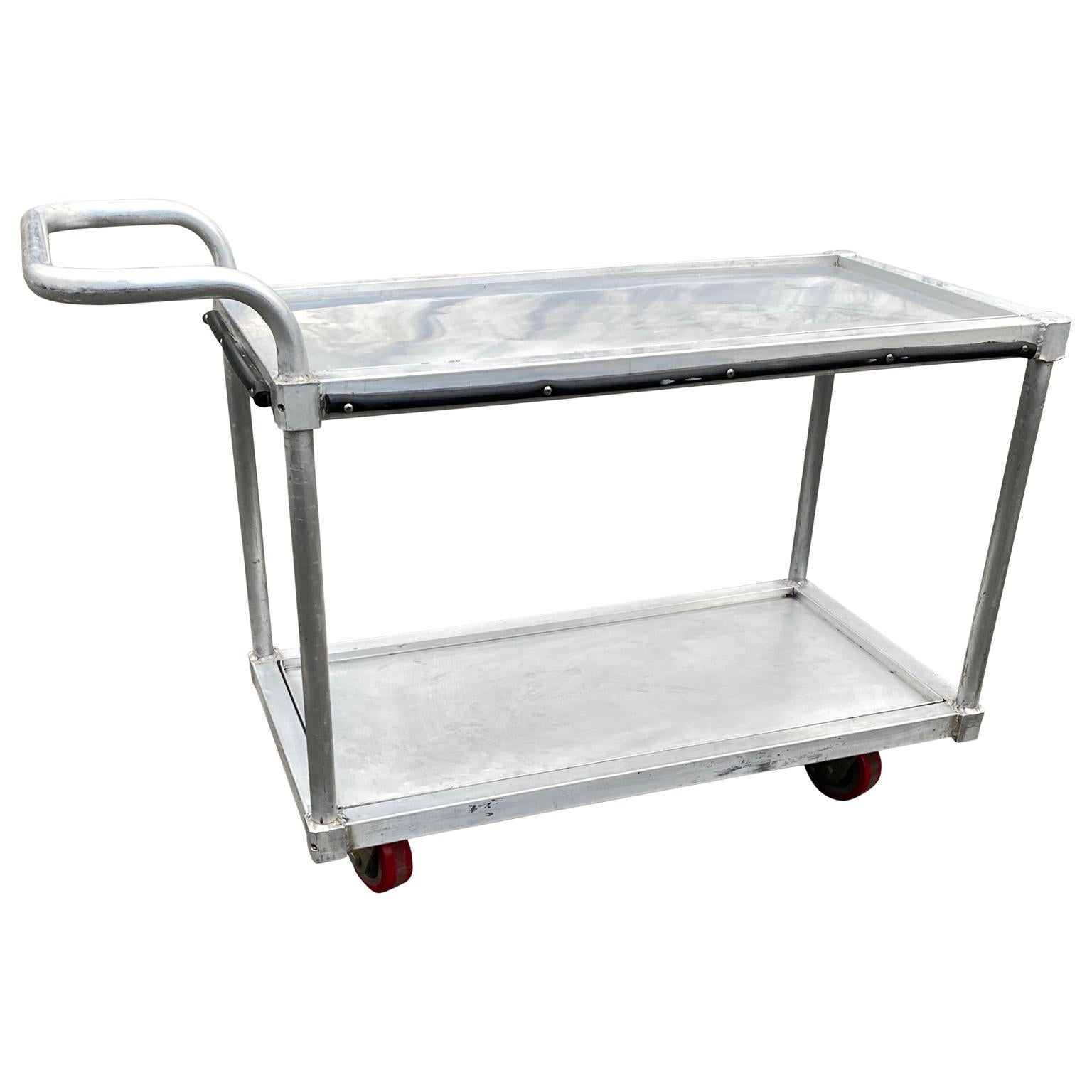 Vintage industrial style two-tier stainless steel rolling bar cart
Each shelf has a detachable tray.

 