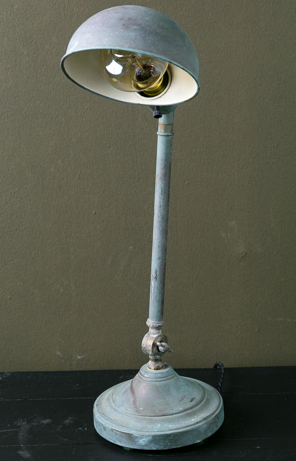 This desk or table lamp has been restored and rewired in the US keeping its authentic patina. It was wired using a porcelain socket. The patina is authentic and interesting. This sort of light can also be named task lighting.