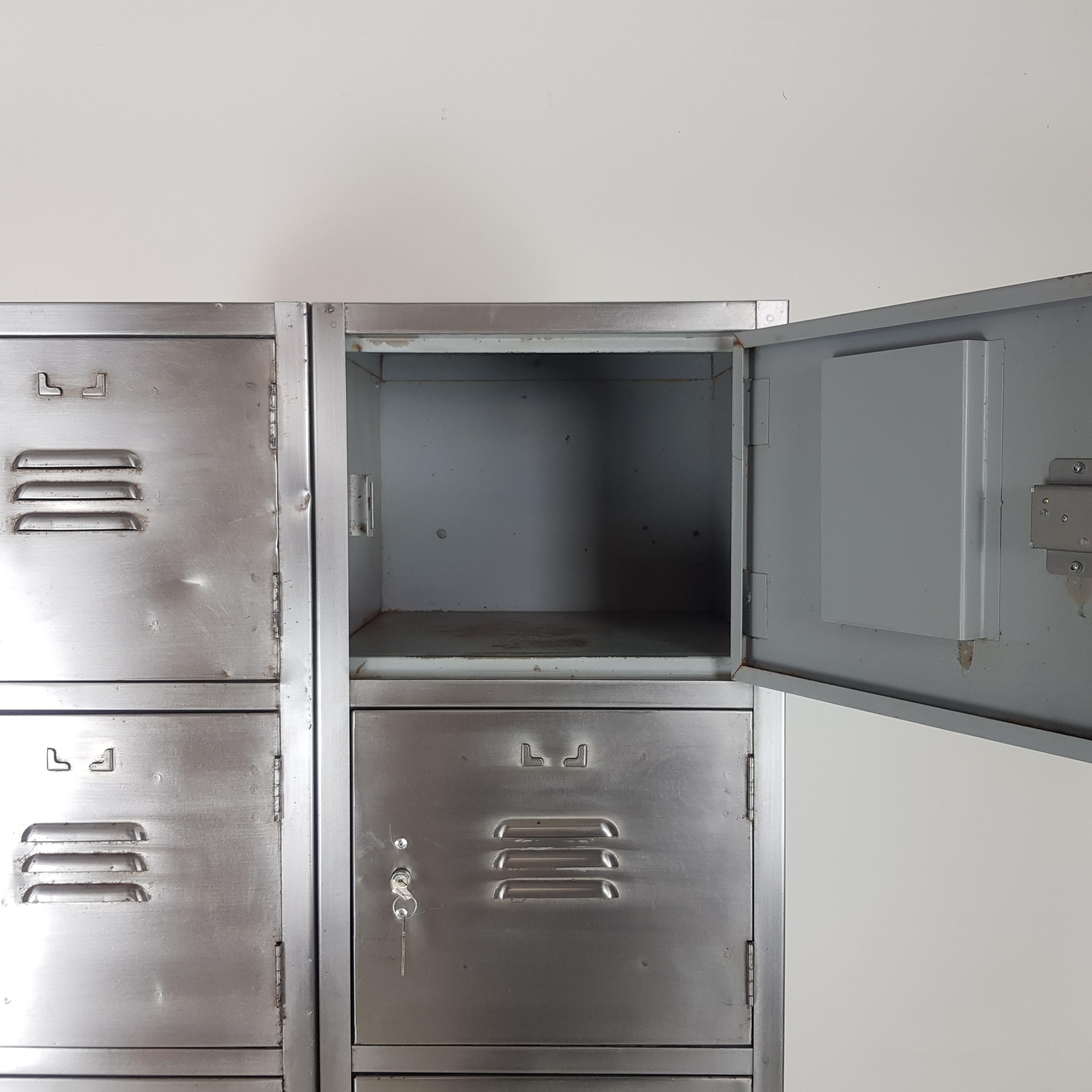 Vintage stripped and polished steel school locker with 10 compartments.

They have working locks and keys.

Please note that, due to its age and the type of setting it's been salvaged from, there are signs of wear including small dents and