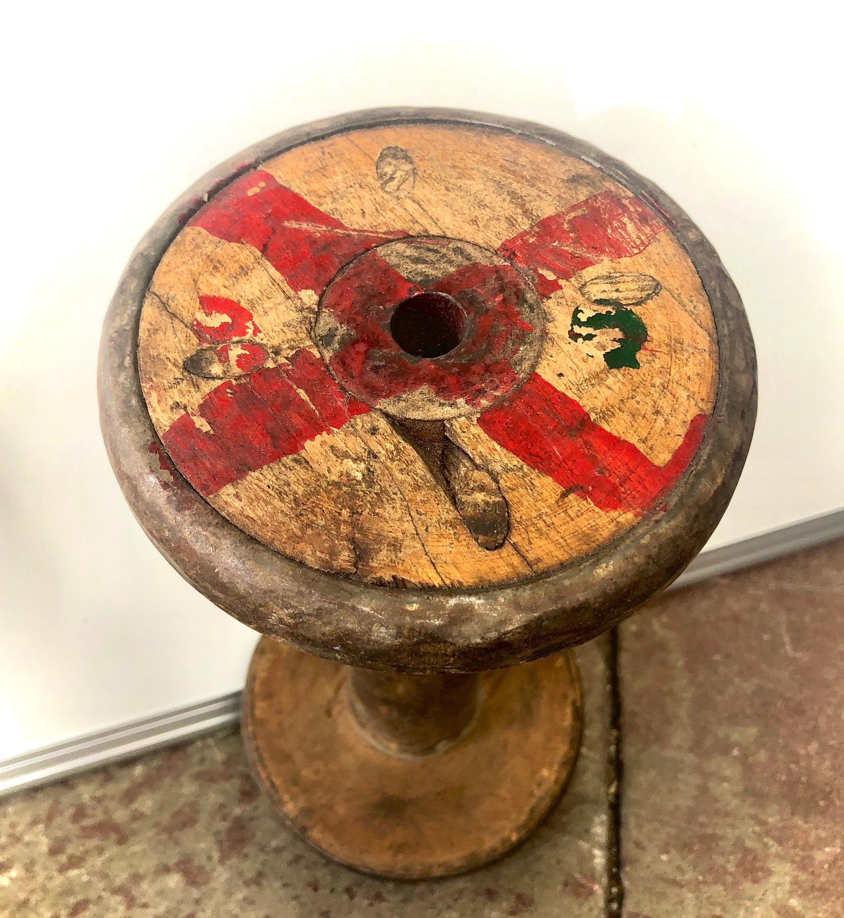 Each wood and metal bobbin has unique color markings
as well a patina that tells of its history of long use. 

 