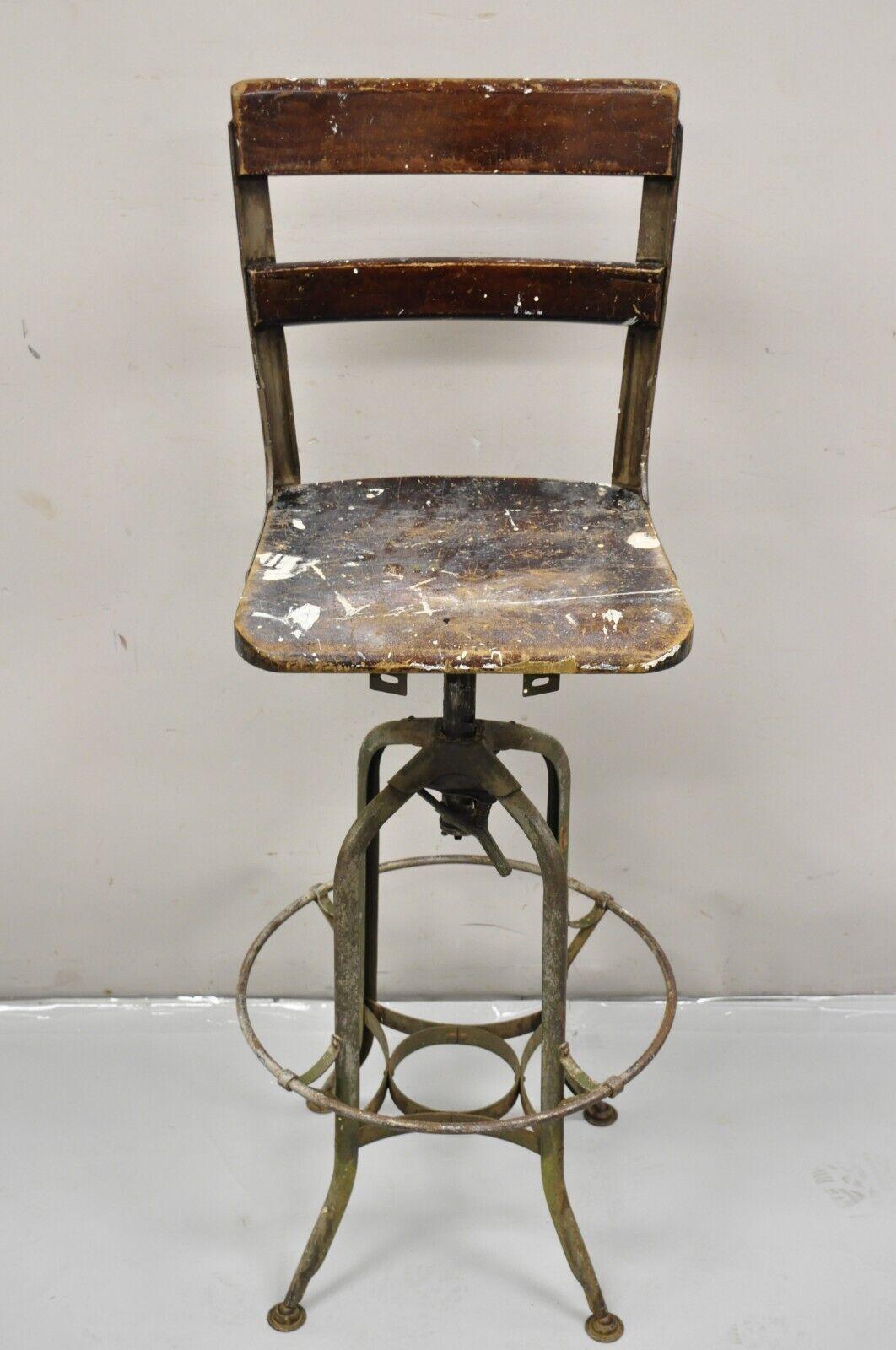 Vintage Industrial Toledo Metal Co Steel and Wooden Adjustable Drafting Stool Work Chair. Circa Early 20th Century. Measurements: 44