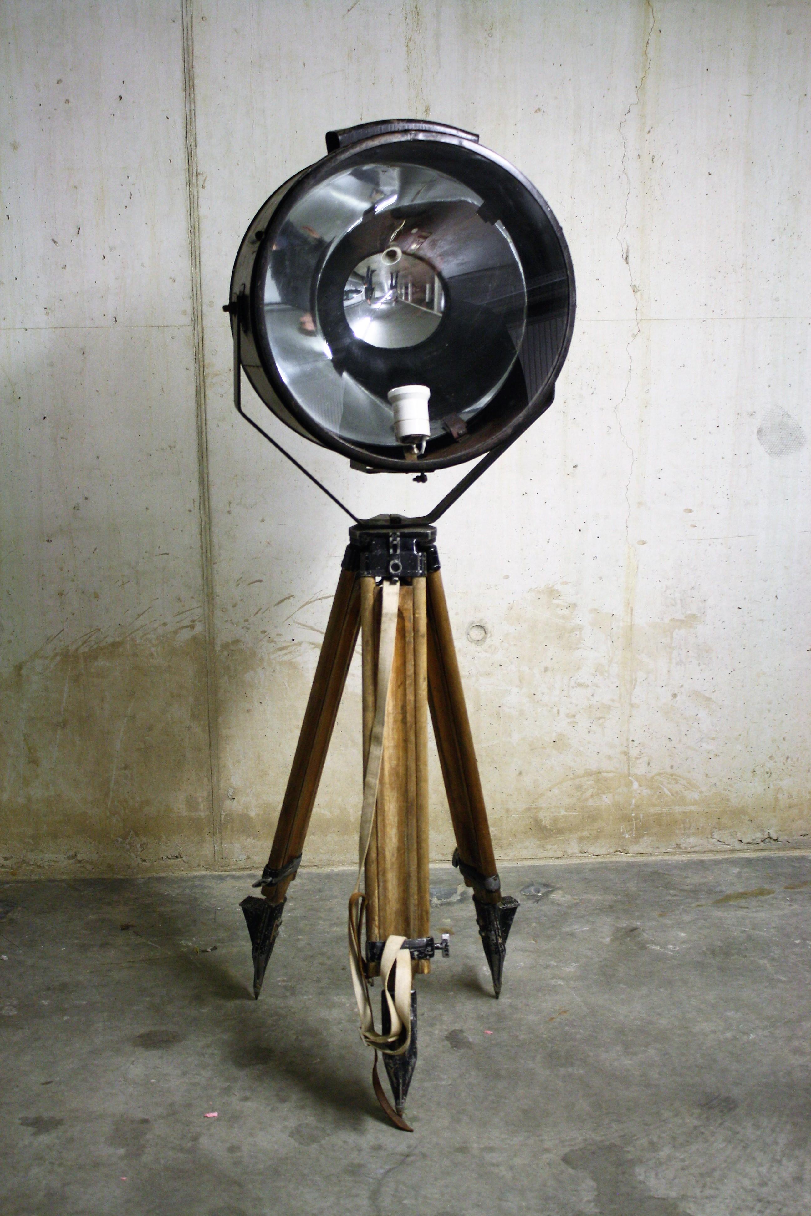 Wonderful large industrial floor lamp.

This lamp was salvaged from an old Russian ship and was used to make light on the upper deck.

The lamp has a mirrored reflector on the inside in order to transmit stronger light.

To make it authentic