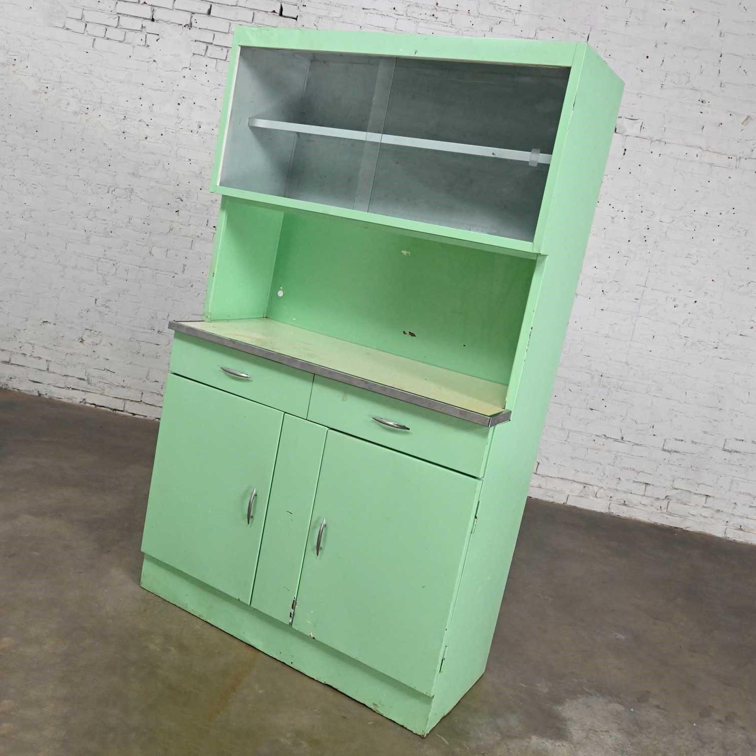 vintage metal cabinet with glass doors