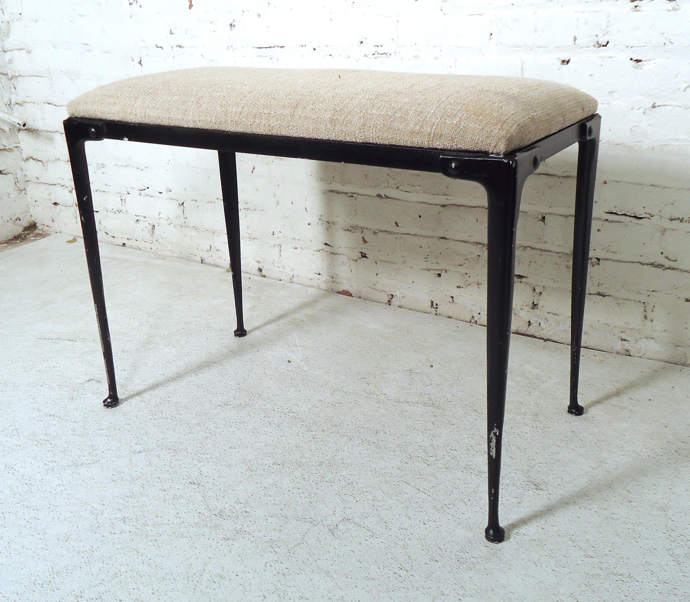 Vintage light upholstered bench restored in a black metal finish. Would give a sleek look to home or office.

(Please confirm item location - NY or NJ).