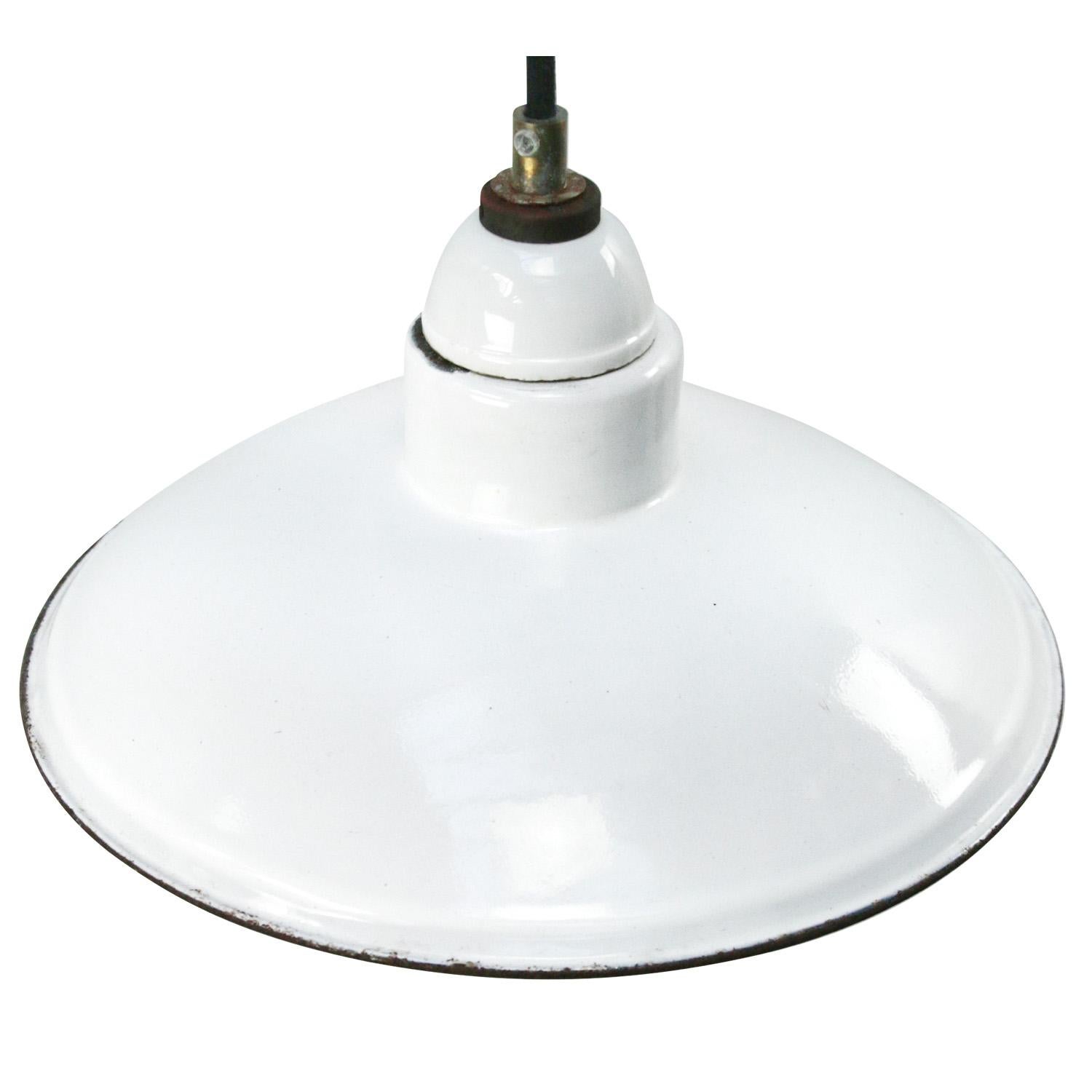 Porcelain Industrial hanging lamp.
White porcelain top with white enamel shade
Brass top
2 conductors, no ground.

Weight: 0.60 kg / 1.3 lb

Priced per individual item. All lamps have been made suitable by international standards for