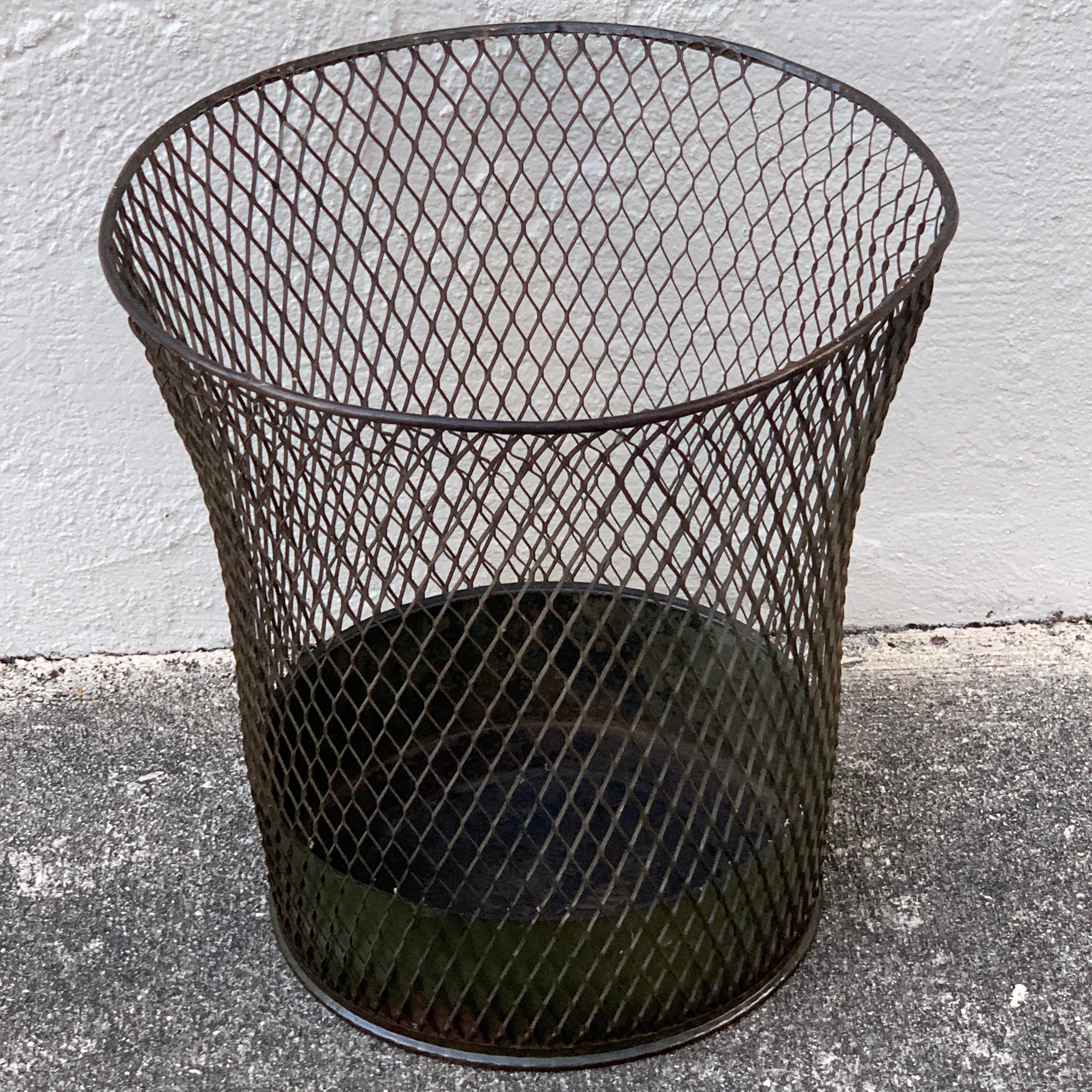 Vintage industrial wire mesh waste paper basket, great shape and form, some minor bends of the frame, presents well, stamped with maker Nemco Industries. Standing 14