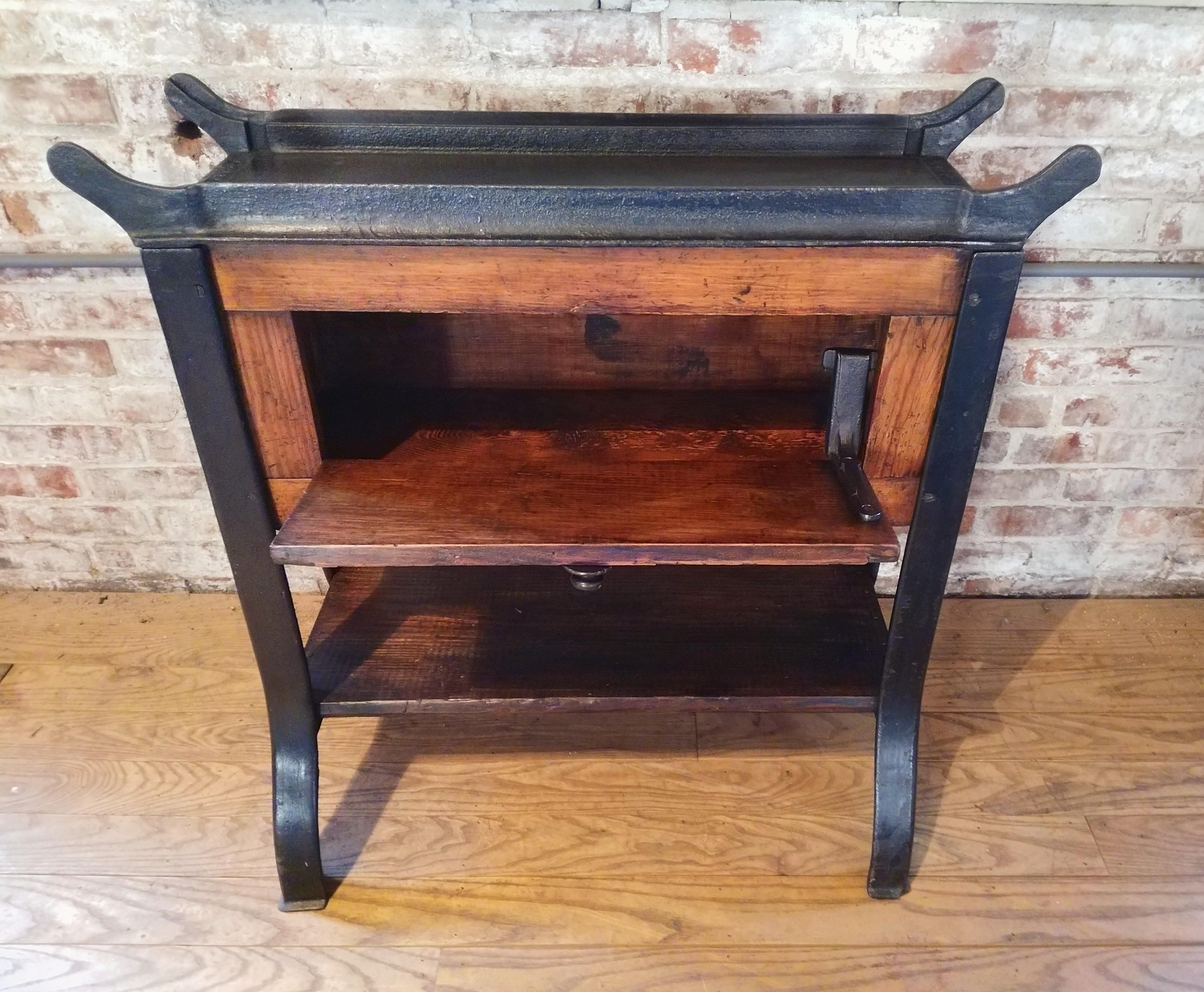 Vintage cast iron and wood printer's proof table with 