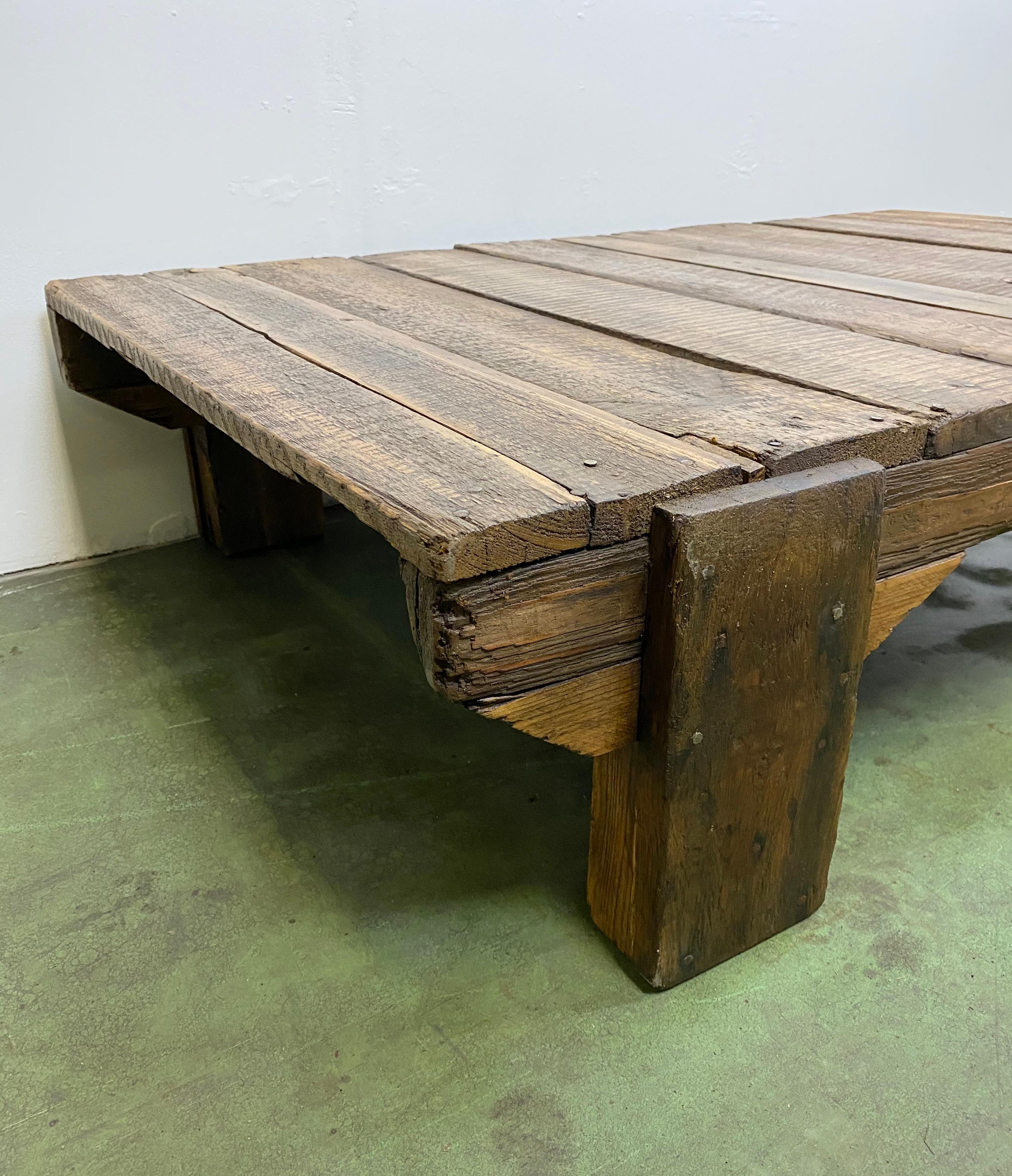This vintage completely wooden coffee table was produced in former Czechoslovakia during the 1950s. The weight of the table is 25 kg. Nice patina.