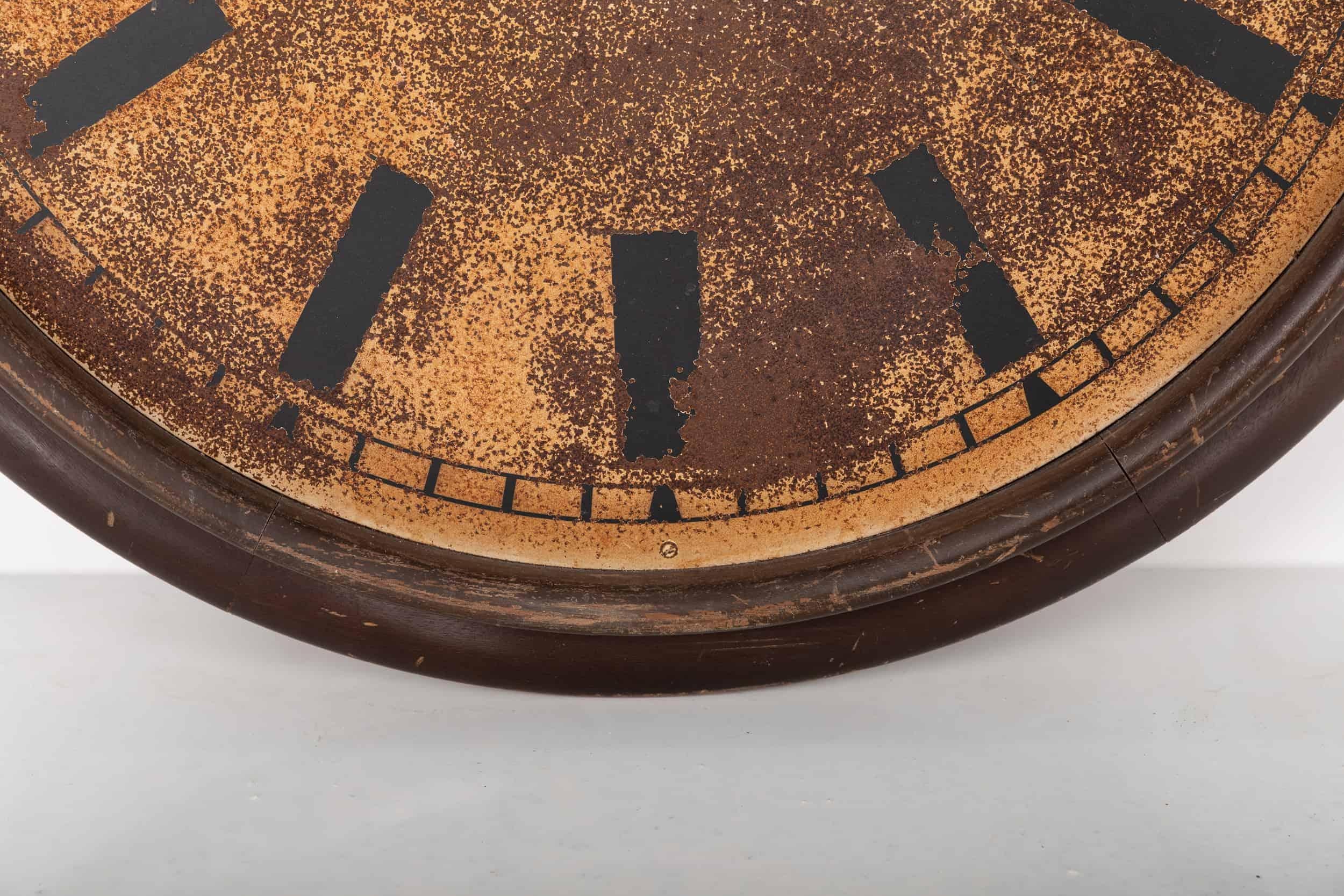 A large and imposing wooden framed industrial wall clock. c.1940

Possibly of European origin, this large open faced dial features black painted chapters and numerals with a heavy patina in the steel dial throughout. This has been sealed to