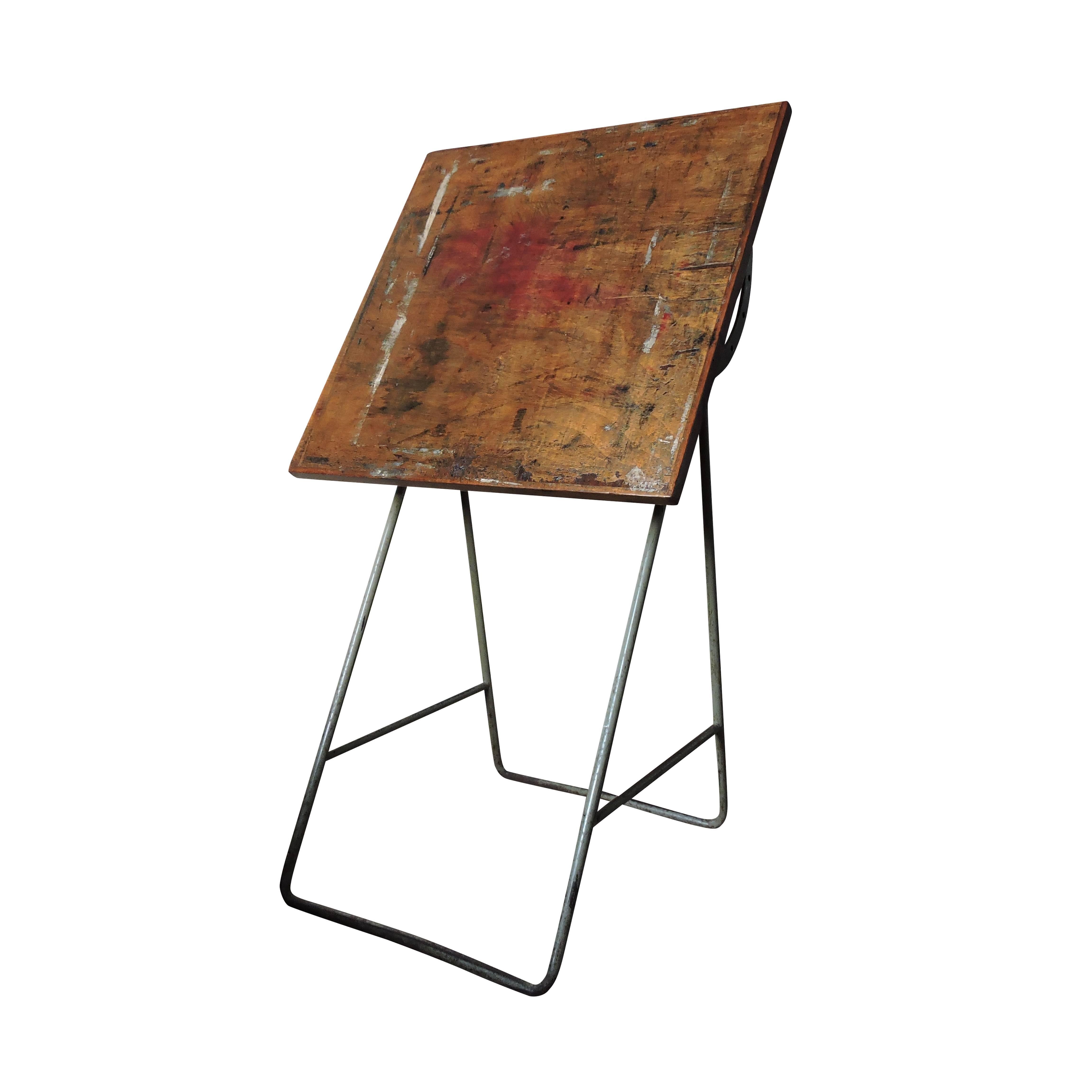 This wooden painting table is height adjustable and was made in Europe during the 1960s.