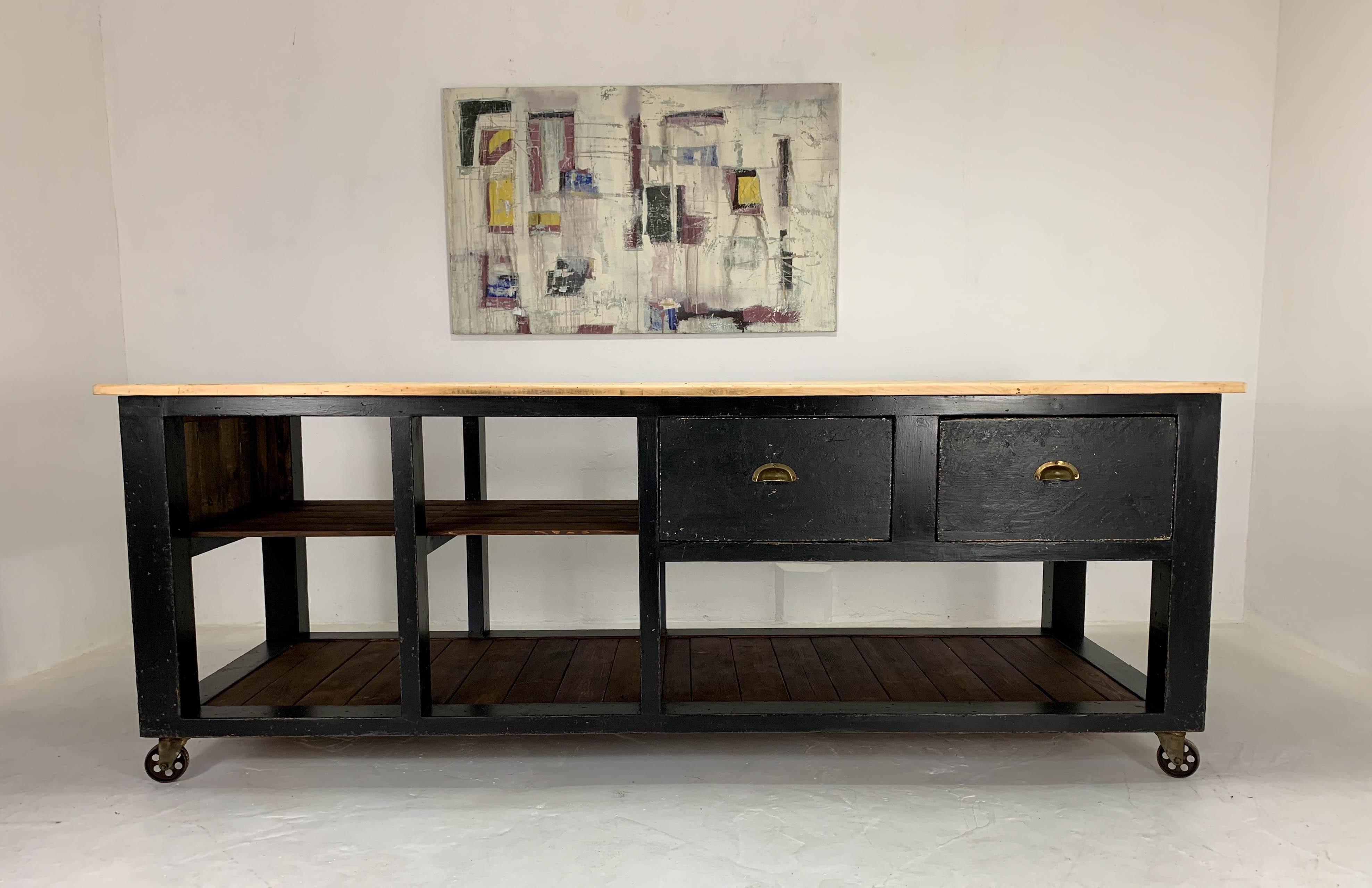 Vintage Baker's table dating from the 1940s, which was part of a clearance we did on an old bakery in Carmarthen- this one was found in an outhouse. The frame has been heavily restored, painted black and distressed. There are two original drawers to