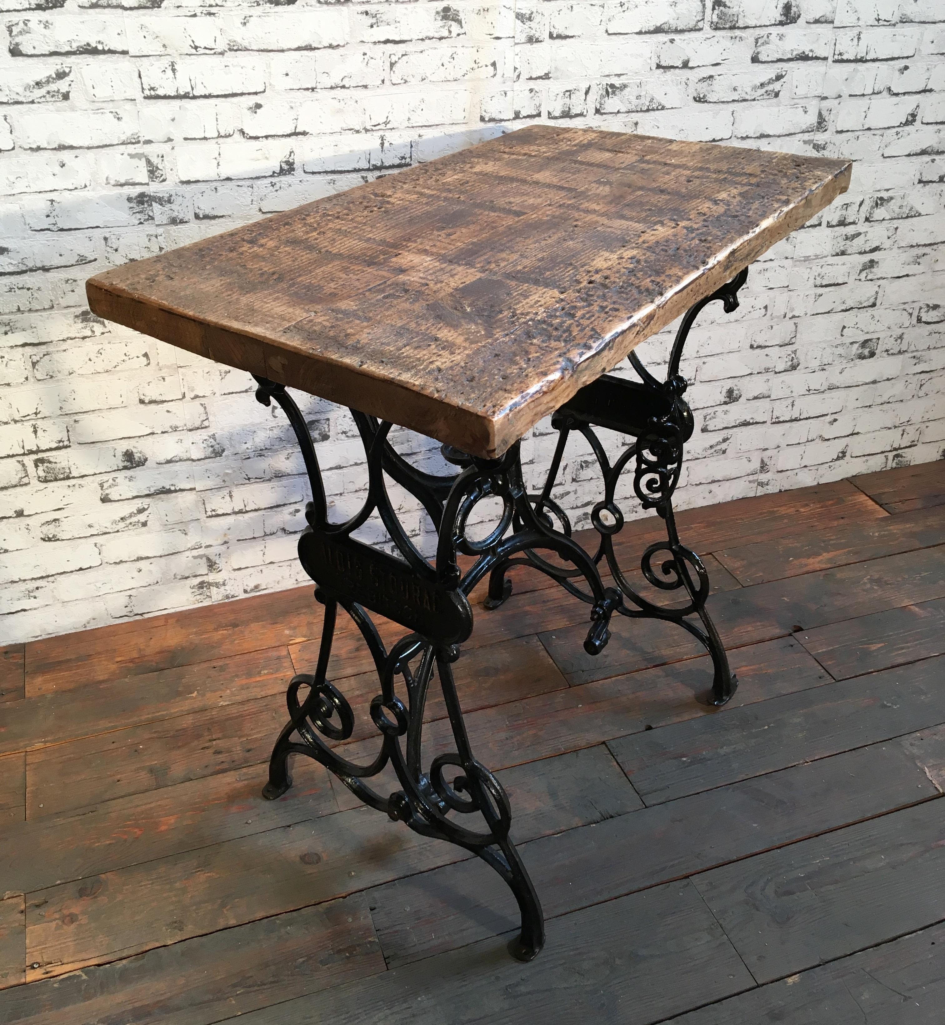 This industrial table comes from former Czechoslovakia from 1930s. Old wooden top was recently mounted on a sewing table cast iron base. Weight of the table is 23 kg.