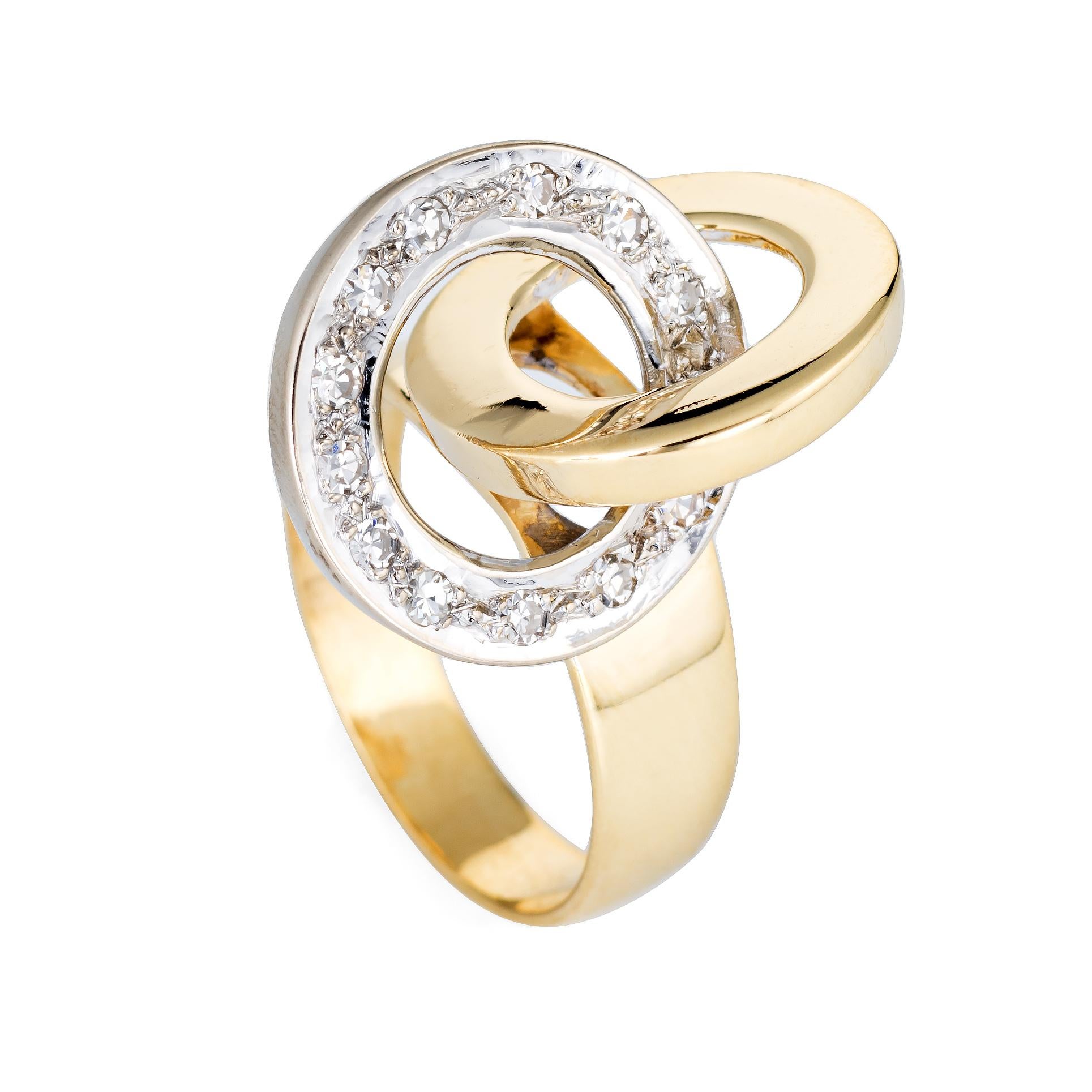 Stylish vintage diamond infinity knot ring (circa 1960s to 1970s) crafted in 18 karat yellow gold. 

13 single cut diamonds total an estimated 0.13 carats (estimated at G-H color and VS2 clarity).  

The striking infinity knot design represents a