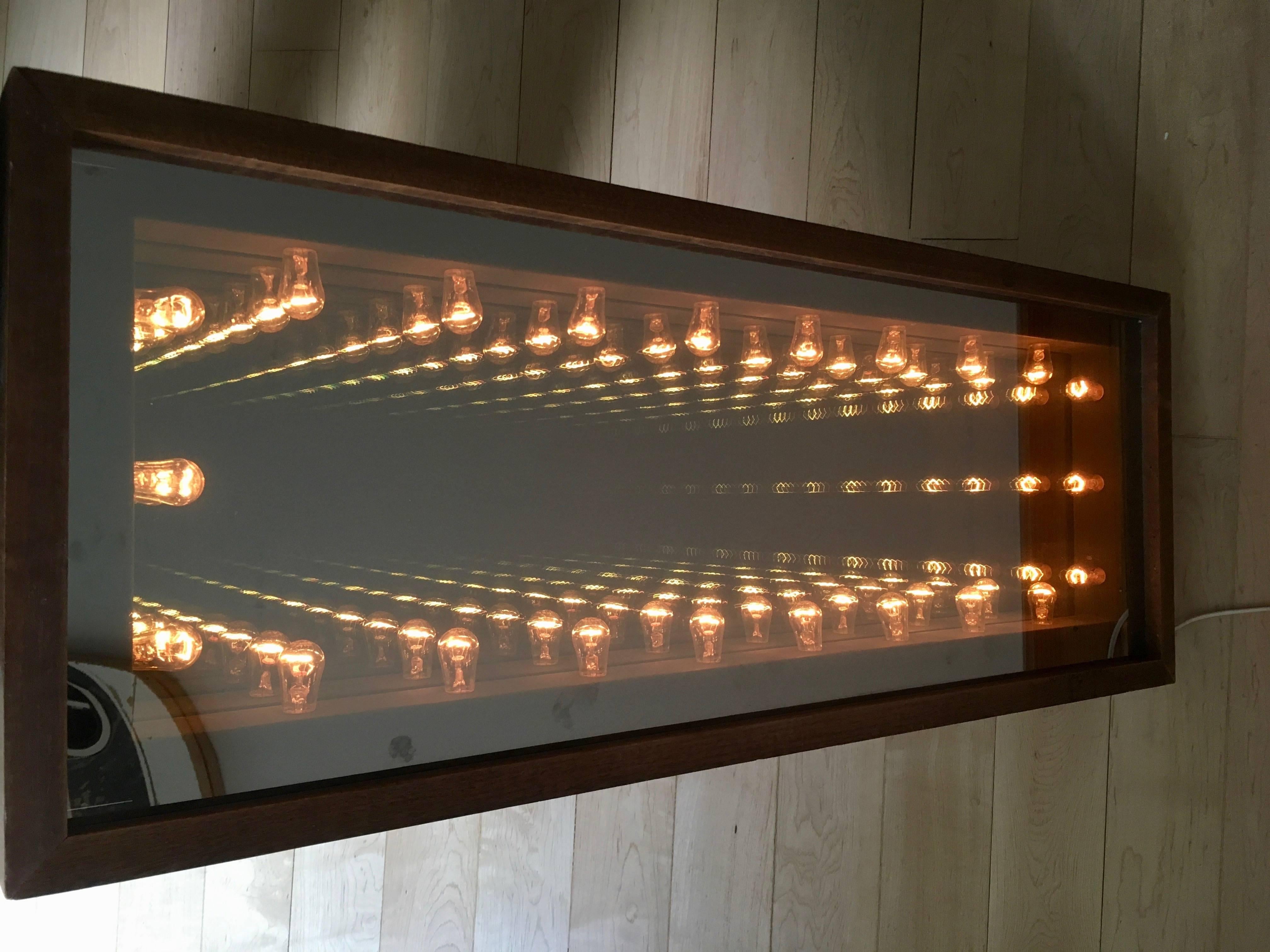 Stunning vintage wood infinity mirror. Great standalone piece of art. Perfect ambient piece of wall art that is a statement in any room. Interesting light bulbs. Fantastic infinity effect. Excellent condition.