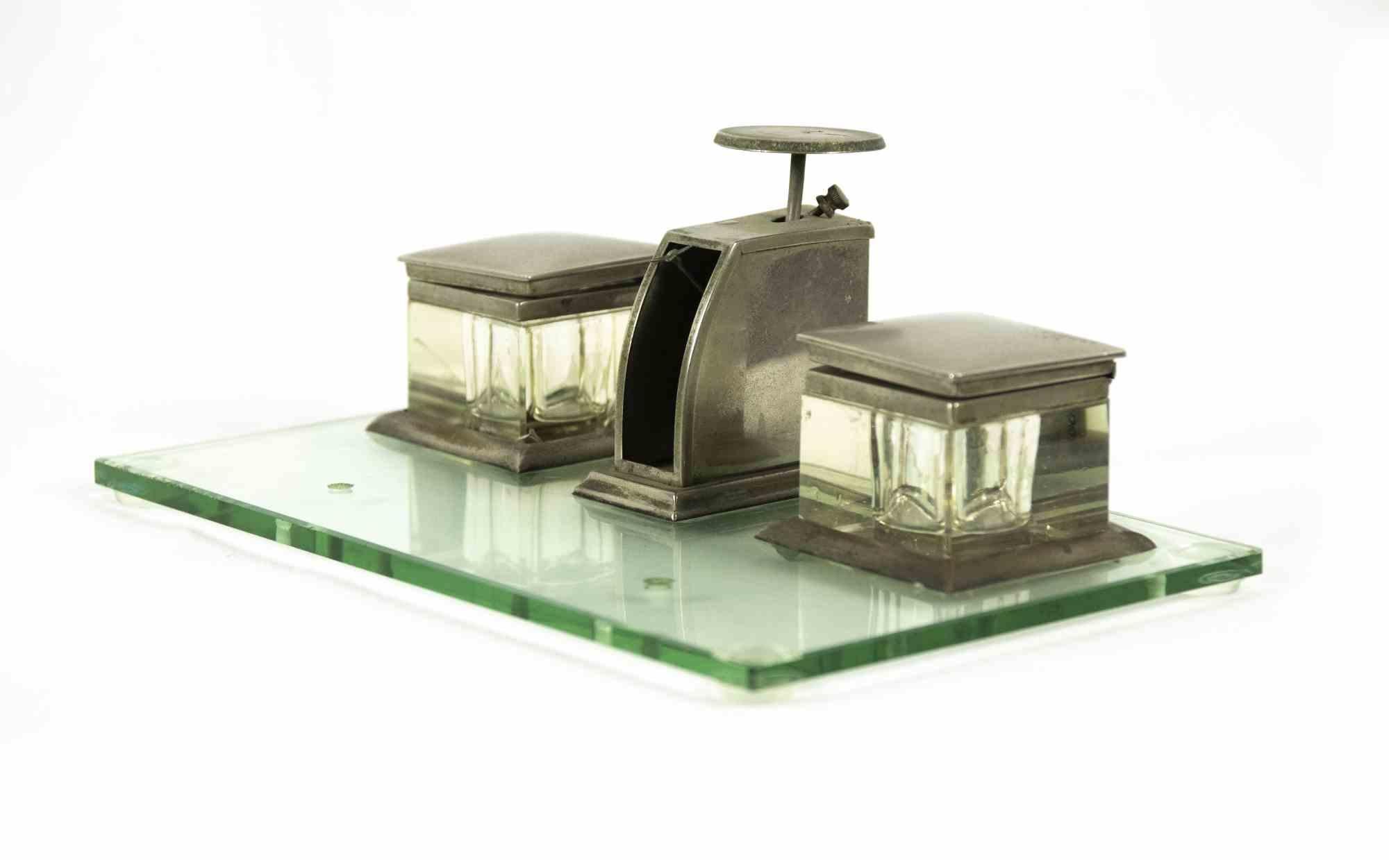 Vintage inkwell is a decorative object realized in the Mid-20th Century

Silver and glass inkwell.

Fair conditions due to the time