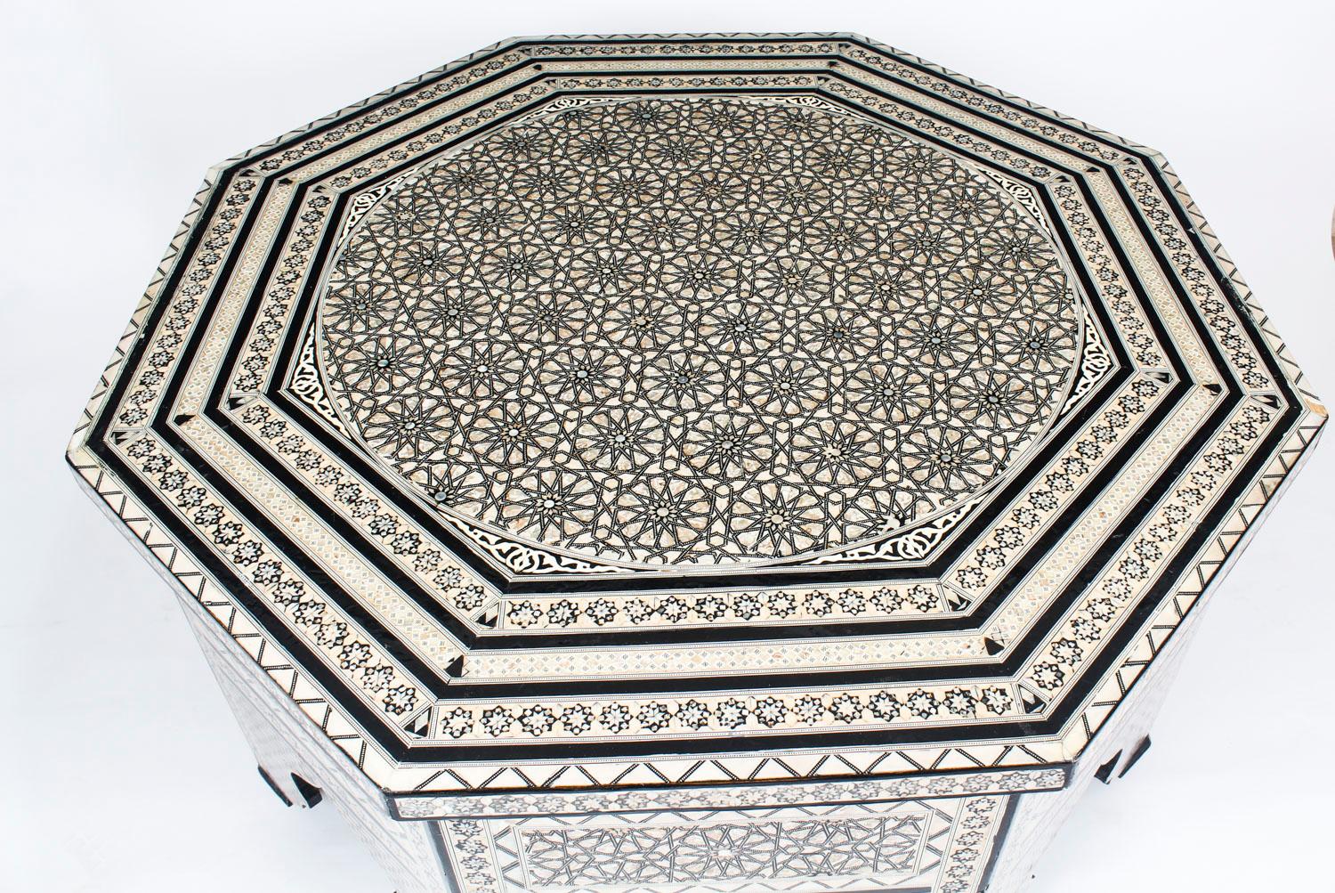 This is a superb intricately inlaid mother of pearl Damascus centre table or coffee table, dating the mid-20th century.

The octagonally shaped table features beautifully detailed inlaid mother of pearl parquetry in interlocking patterns all