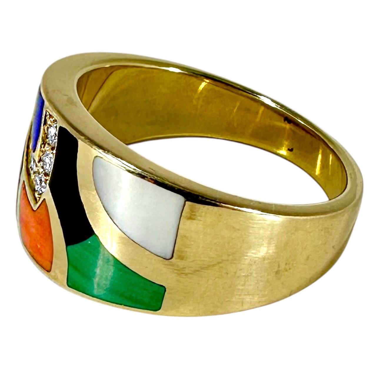 This vintage 14K yellow gold ring by  Asch Grossbardt is designed in an organic motif, and is masterfully set with inlaid Mother-of-Pearl, Malachite, Coral, Black Onyx and Lapis-lazuli. The inlaid stones are accented with six modern round brilliant