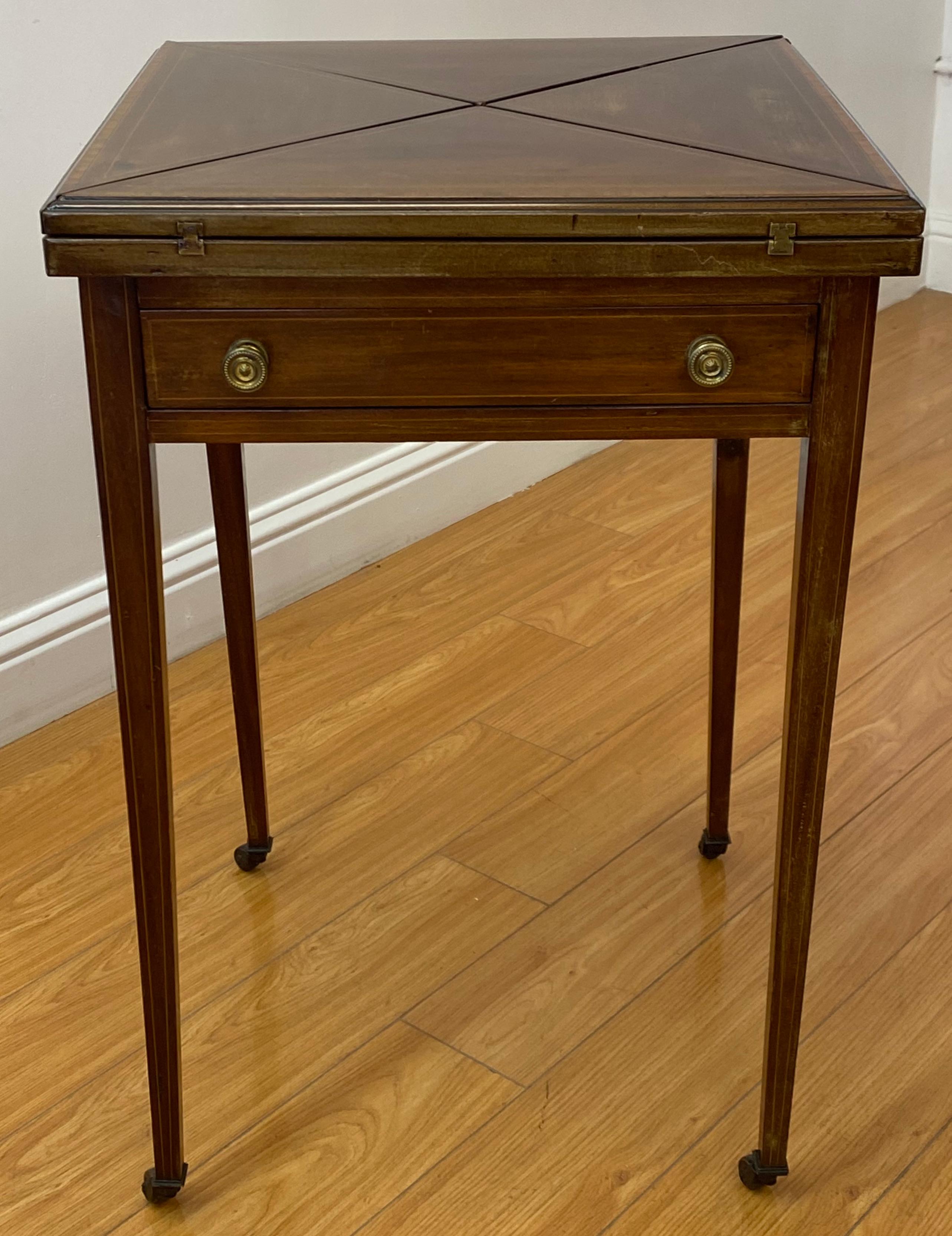 Vintage inlaid mahogany handkerchief folding games / side table, C.1940

One leg shows a past repair (as found, see pics)

The table folds open and closed. 

A fine side table (when closed)

A fun games table (when open)

20