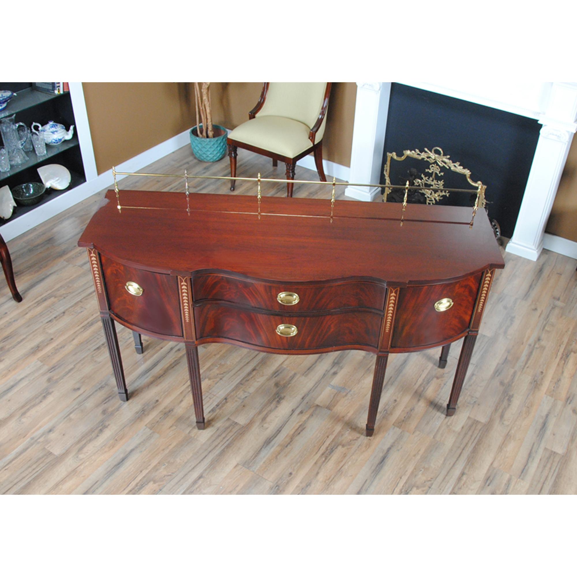 A vintage Vintage Inlaid Mahogany Sideboard in excellent condition with the top having recently been French polished to give it that “factory fresh” look and feel.

Simple yet sophisticated this beautiful Vintage Inlaid Mahogany Sideboard has a