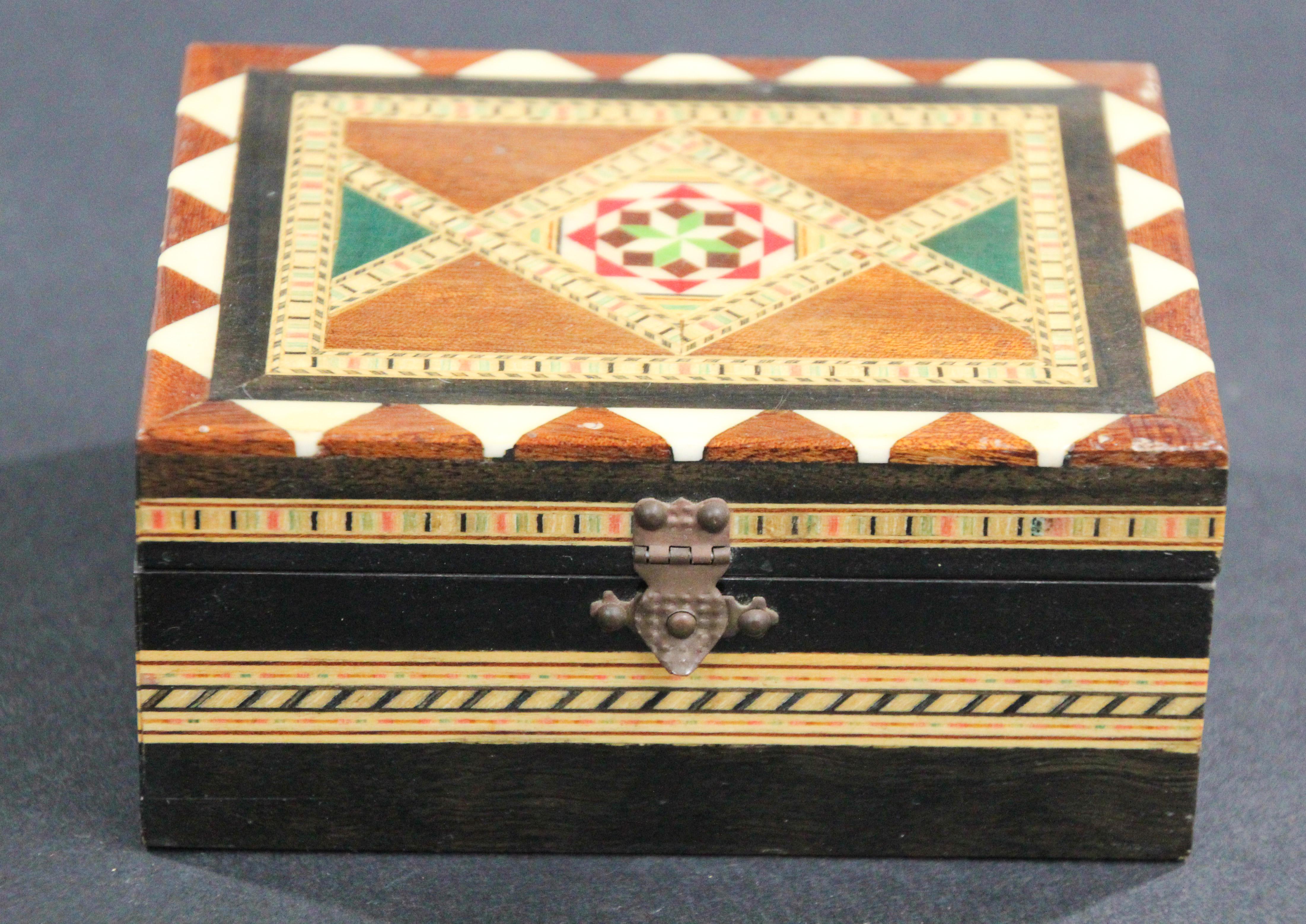 Exquisite handcrafted Middle Eastern mosaic marquetry inlaid walnut wood box.
Handmade Vintage small Marquetry trinket box by Victor Molero, handcrafted in Granada Spain.
Small box intricately decorated with Moorish motif designs which have been
