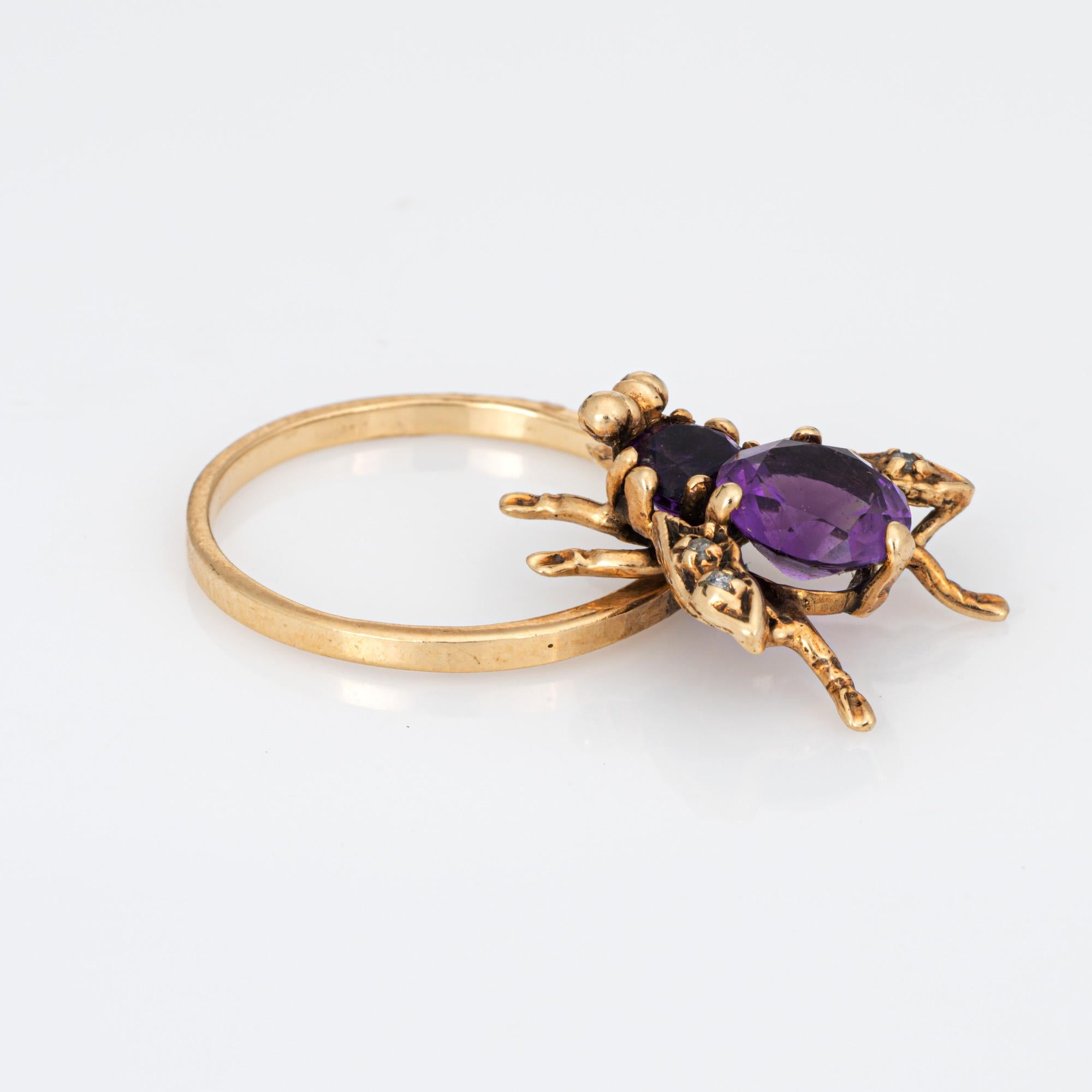 Stylish vintage amethyst & diamond insect ring (circa 1960s to 1970s) crafted in 14 karat yellow gold. 

Faceted round cut amethyst measures 7mm with the smaller amethyst measuring 4.5mm. Four small diamonds are set into the wings totaling an
