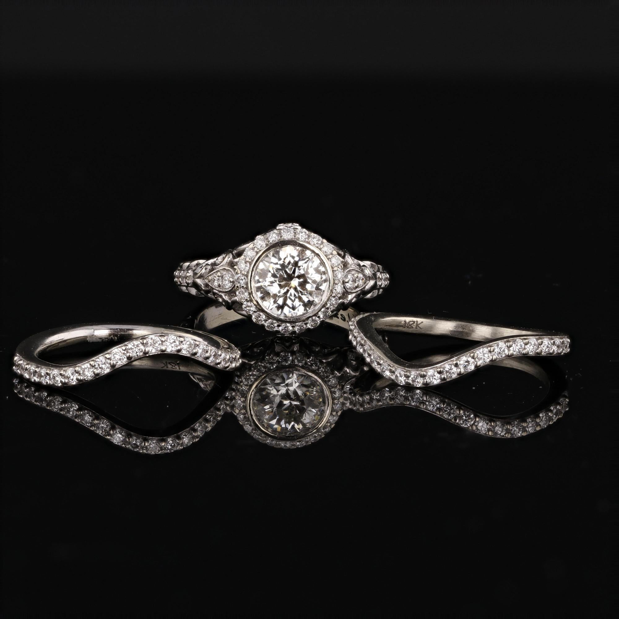 Reminiscent of another era, this Alex & Co signature vintage-style for our Bridal Collection is a magnificent 18K white gold engagement ring and elegant couture prefect fitted diamond pave matching wedding band set. The signature engagement ring