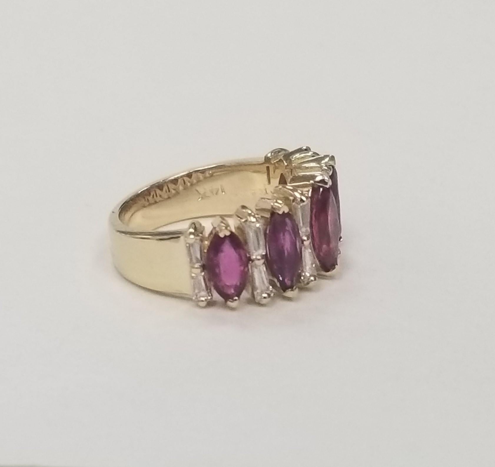 Vintage 14k Yellow gold Marquise Ruby and Baguette Cut Diamond Wedding Ring . 
Specifications:
Metal: 14K White Gold
Center Stone: 5 Marquise Cut Rubies 3.30 cts.
Side Stones: 12 Baguette Diamonds .70 cts.
Color: G
Clarity: VS
Size: 6.5US
Gram