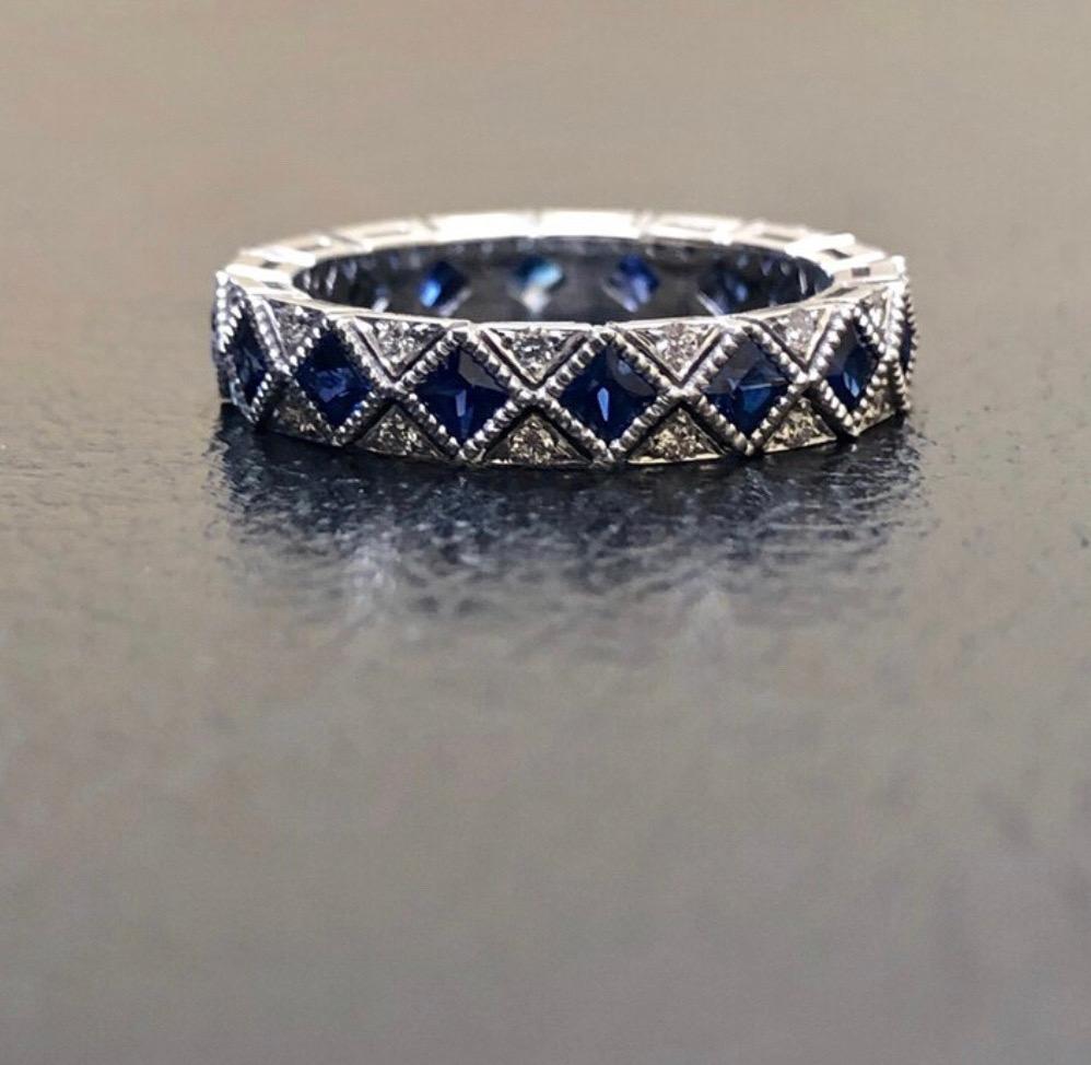 Dekara Designs Collection

Art Deco Inspired Princess Cut Ceylon Blue Sapphire and Diamond Eternity Diamond Band.

This piece is handmade to perfection, from the stone setting to the shine finish. High end heirloom diamond band.

Metal- 90%
