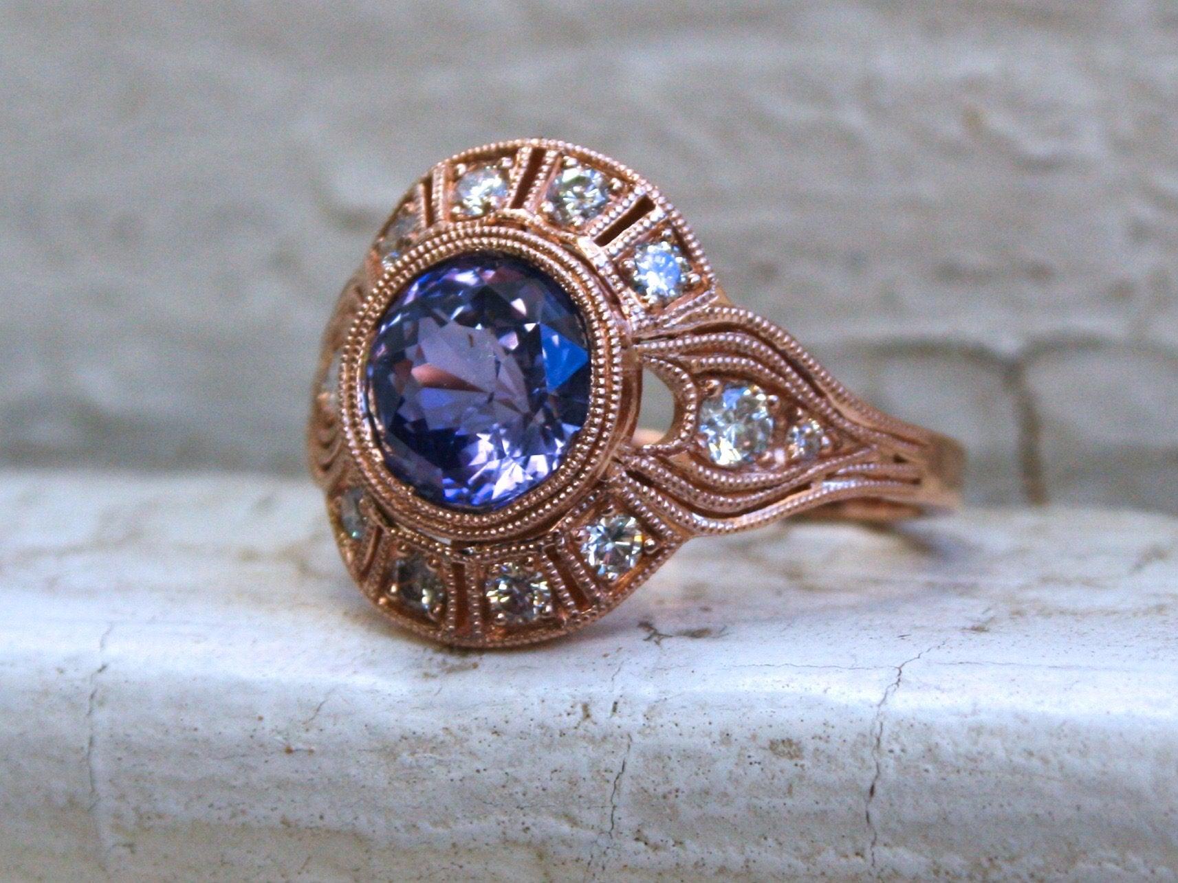 This piece is a modern recreation of an amazing authentic Art Deco Vintage Ring we sold! The ring was so gorgeous we just had to remake it! Simply stunning, and the sparkle is amazing! 

In the center, we have a gorgeous Natural Lavender Ceylon