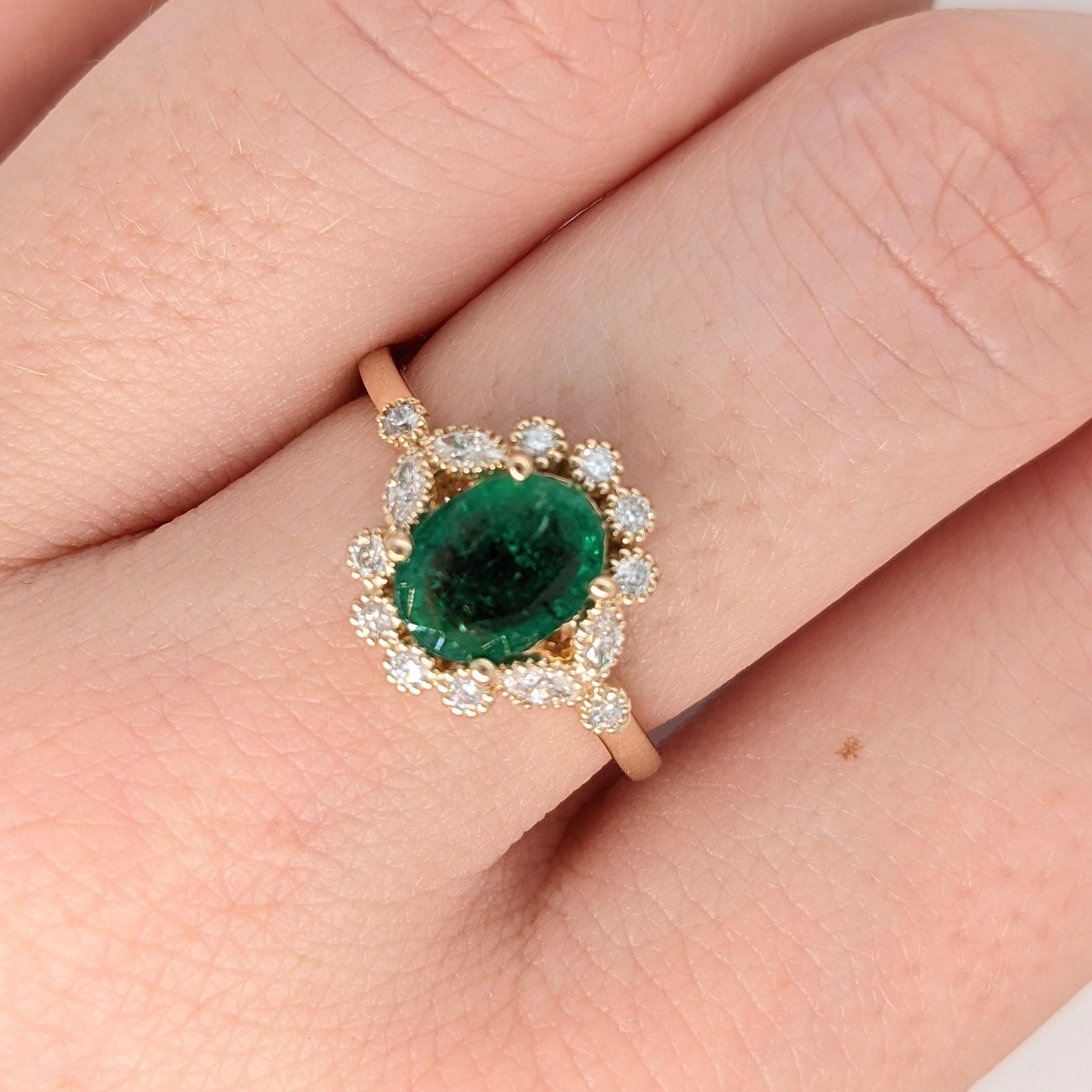 This beautiful vintage inspired ring features a vibrant green emerald in 14k yellow gold with milgrain detail. A ring design perfect for an eye catching engagement or anniversary. This ring also makes a beautiful May birthstone ring for your loved