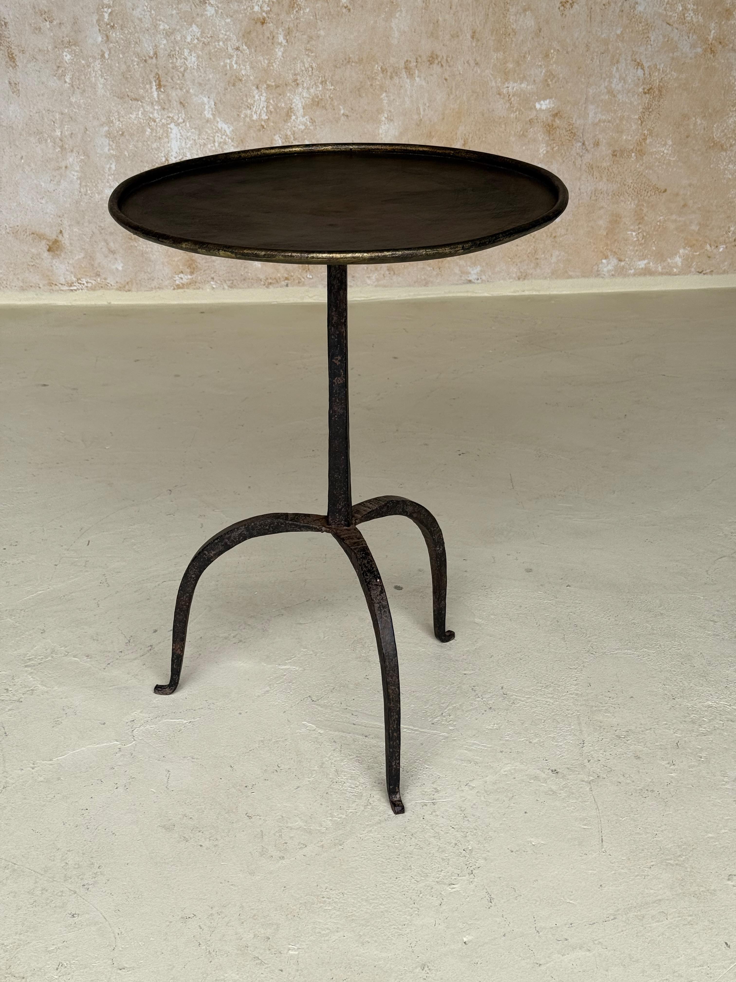 TG0225-24

Vintage-Inspired French Iron Drinks Table with Dark Gilt Patina

This graceful, small-scale side table was recently handcrafted in Europe by skilled artisans using traditional iron-working techniques. Its design features a central round