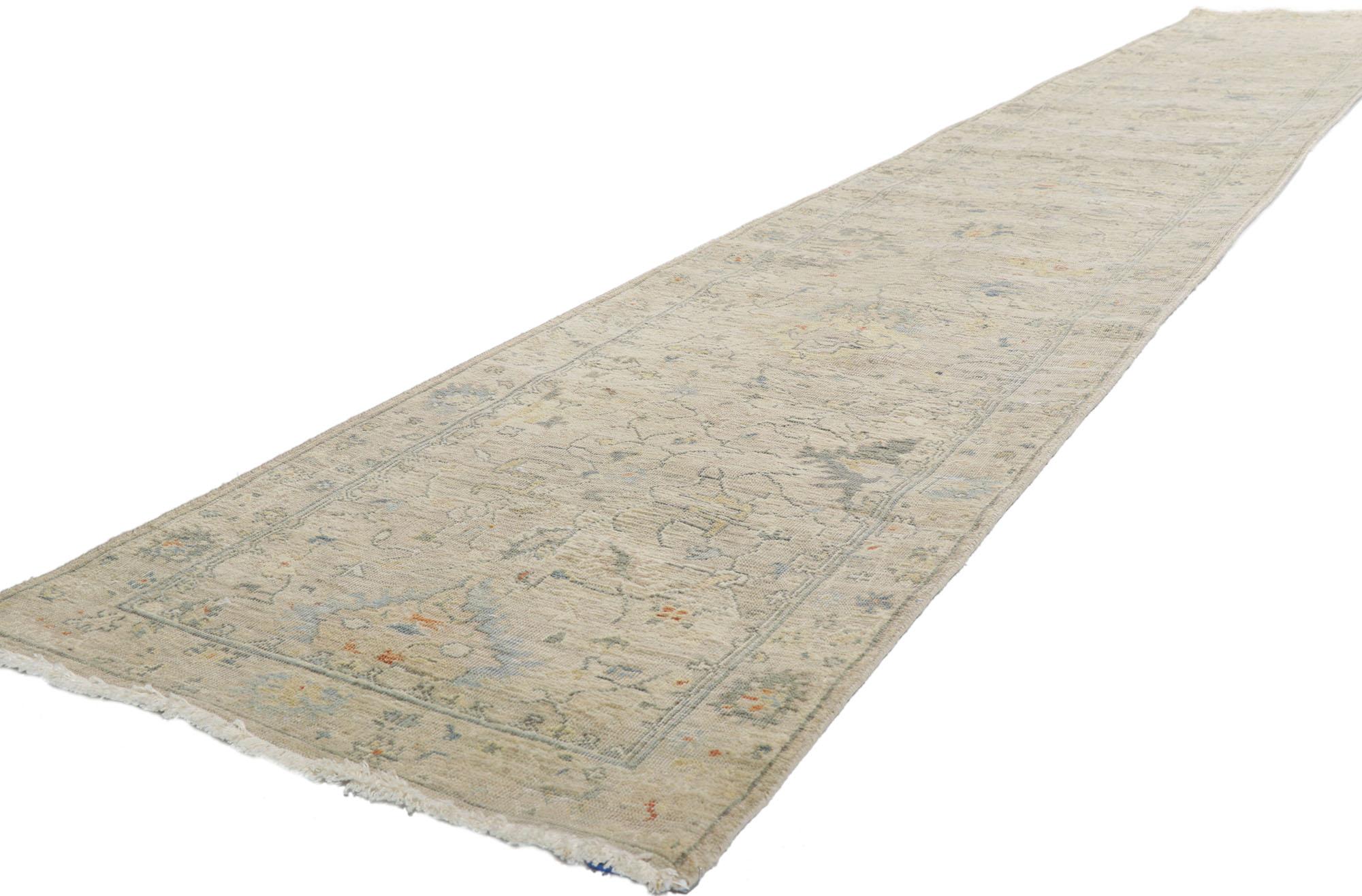 30714 Vintage-Inspired Modern Oushak Rug, 02'05 x 15'08.
Emanating traditional sensibility and rugged beauty with a neutral color palette, this hand-knotted wool distressed Indian Oushak runner creates an inimitable warmth and calming ambiance. The