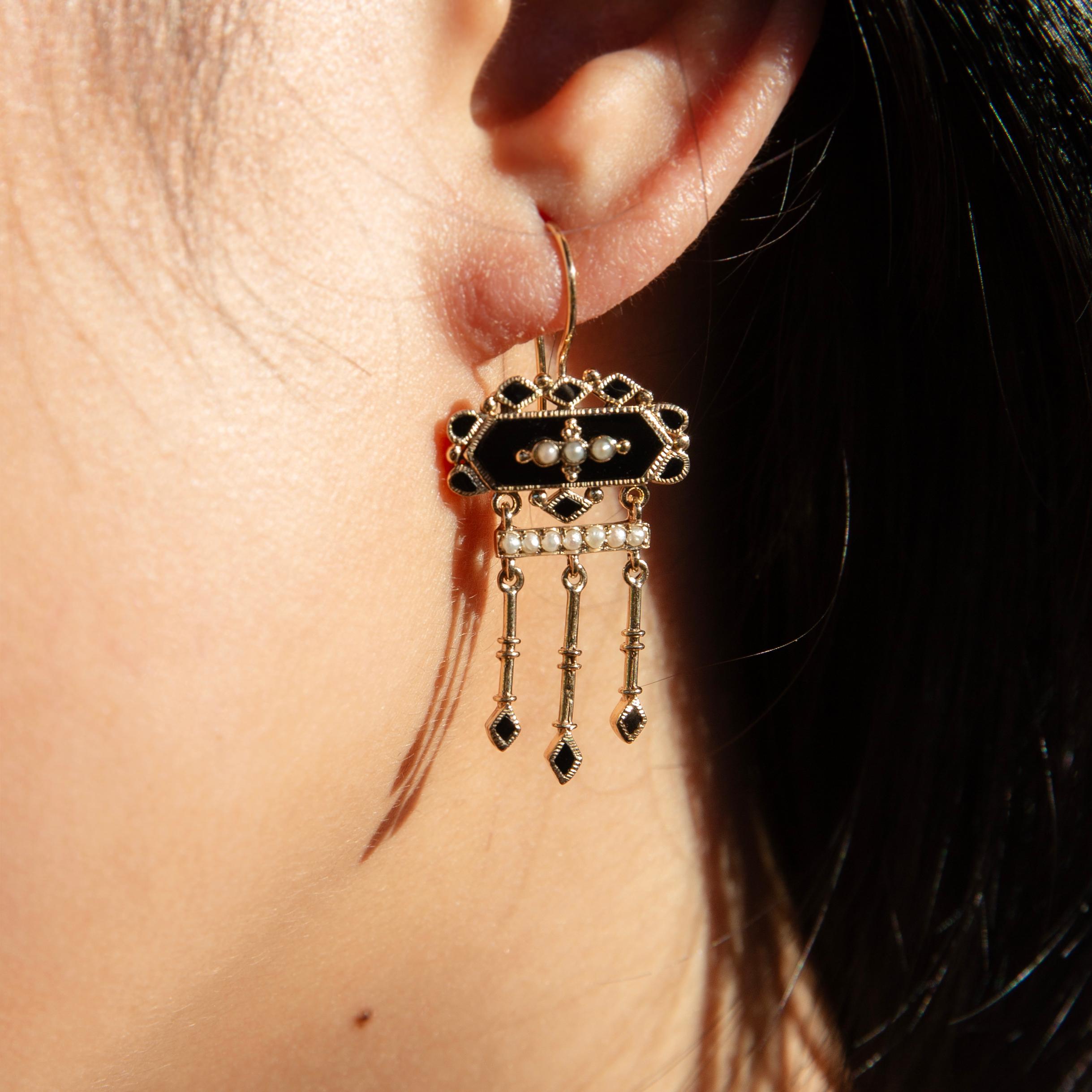Bold and opulent, The Winifred Earrings are a stunning showpiece. Her chandeliers of cascading gold embellished with jet black onyx and creamy seed pearls are designed to steal the limelight. She is the lead in this cinematic masterpiece.

The