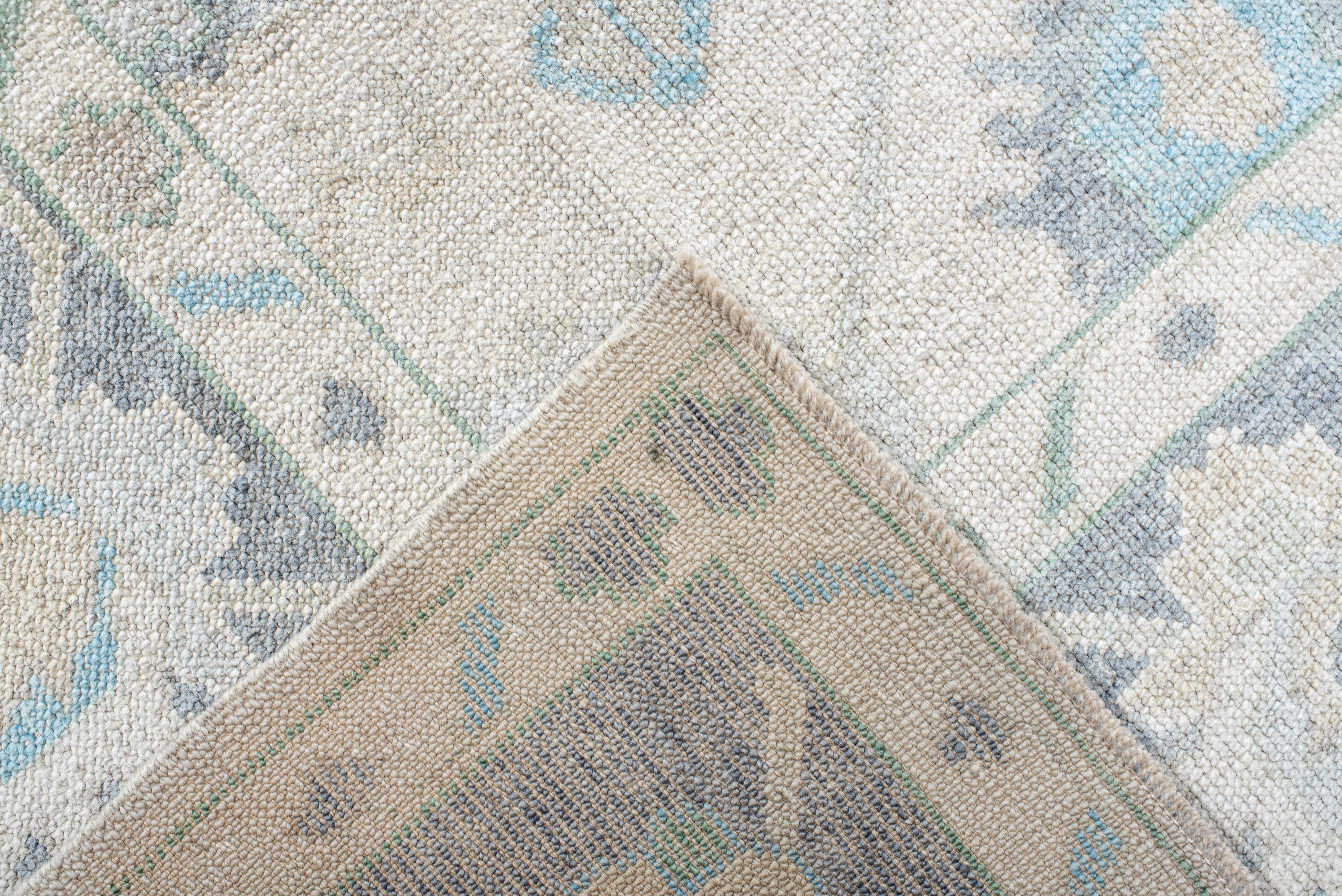 Contemporary Vintage Inspired Oushak Rug in Faded Ivory and Soft Blues For Sale