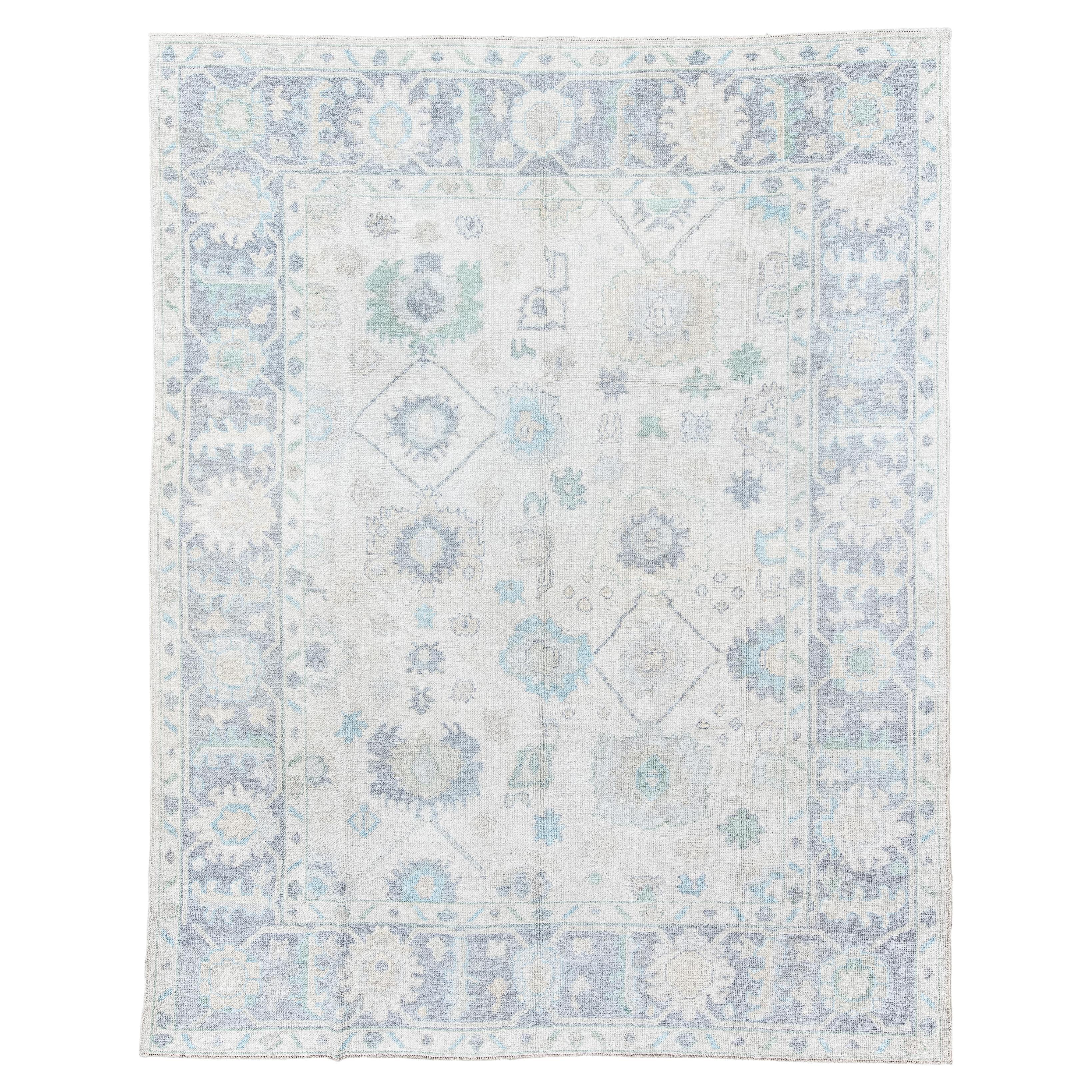 Vintage Inspired Oushak Rug in Faded Ivory and Soft Blues