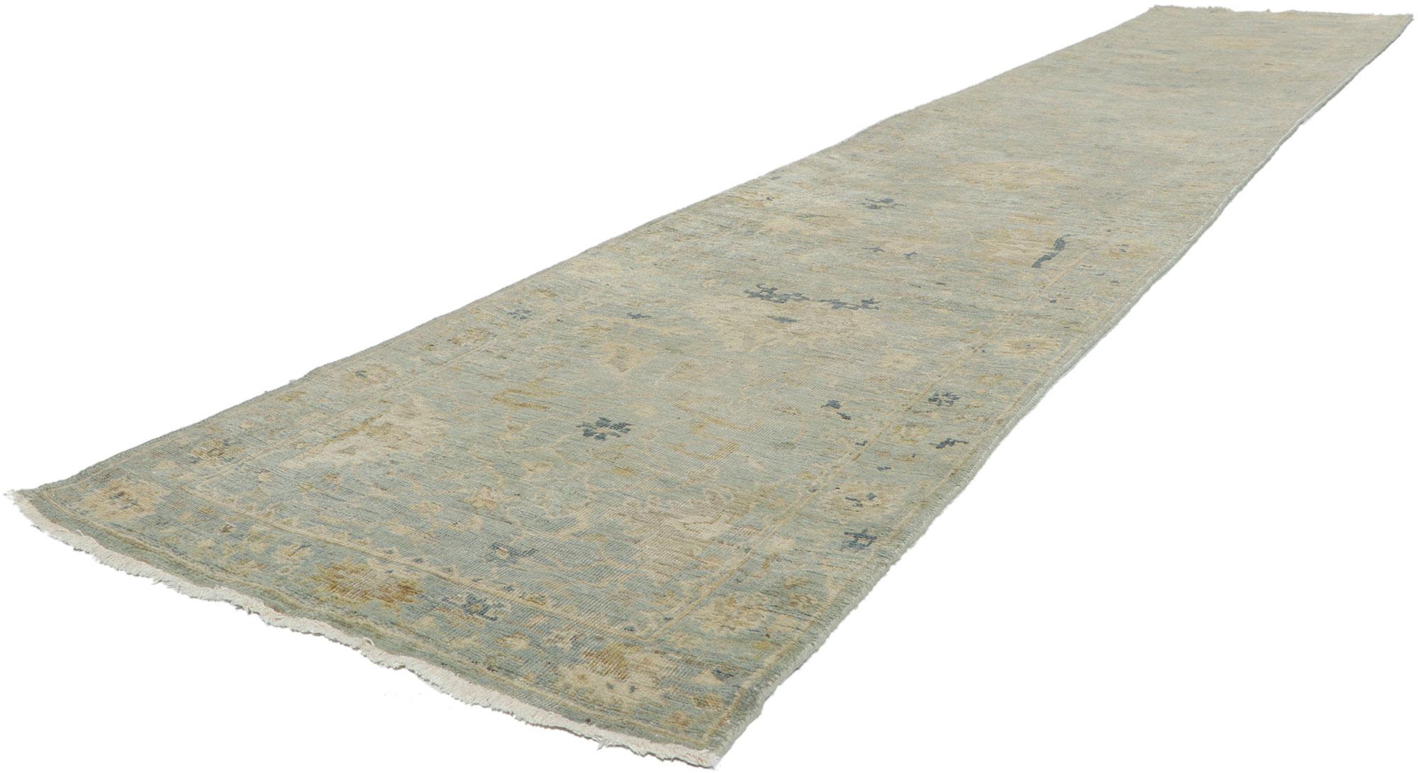 30834 vintage-inspired Oushak Runner 02'06 x 13'07.
Emanating traditional sensibility and rugged beauty with a neutral color palette, this hand-knotted wool vintage-inspired Oushak runner creates an inimitable warmth and calming ambiance. The