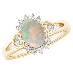 Anello con opale ovale in stile vintage, con montatura a halo e motivi a cuore, in oro massiccio 14K