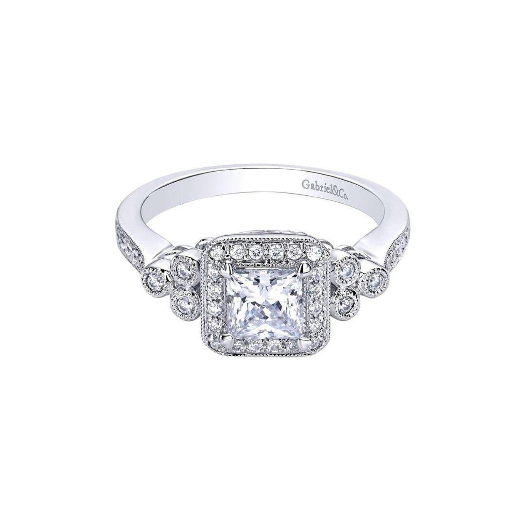 Vintage Inspired Princess Cut Diamond Engagement Ring in 14k White Gold.﻿ This one of a kind engagement ring features vintage inspired design with feminine, romantic curves. Center natural princess cut diamond weighs 0.40 ct, J color, SI2 clarity.