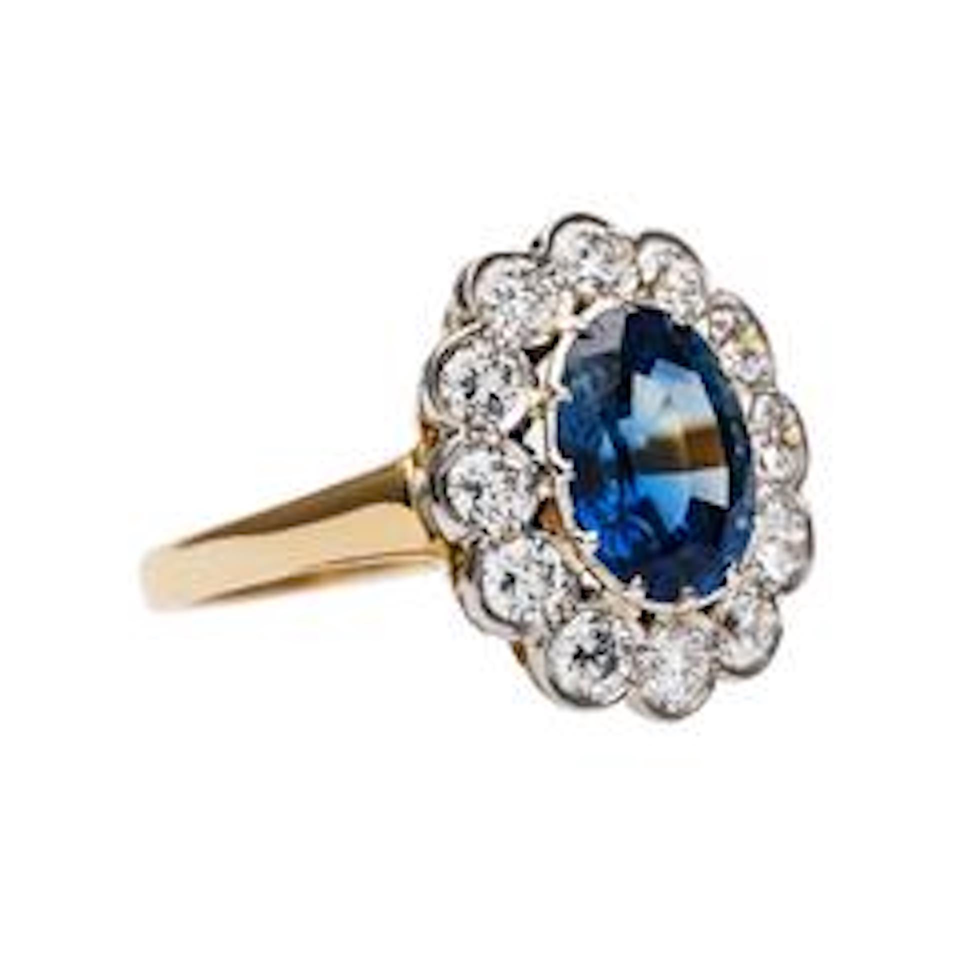 Pondera is a magnificent handcrafted ring designed by Trumpet & Horn made locally in downtown Los Angeles. The platinum and 18k yellow gold ring centers a twelve-prong set Oval Mixed cut natural sapphire accompanied by a Guild Laboratories