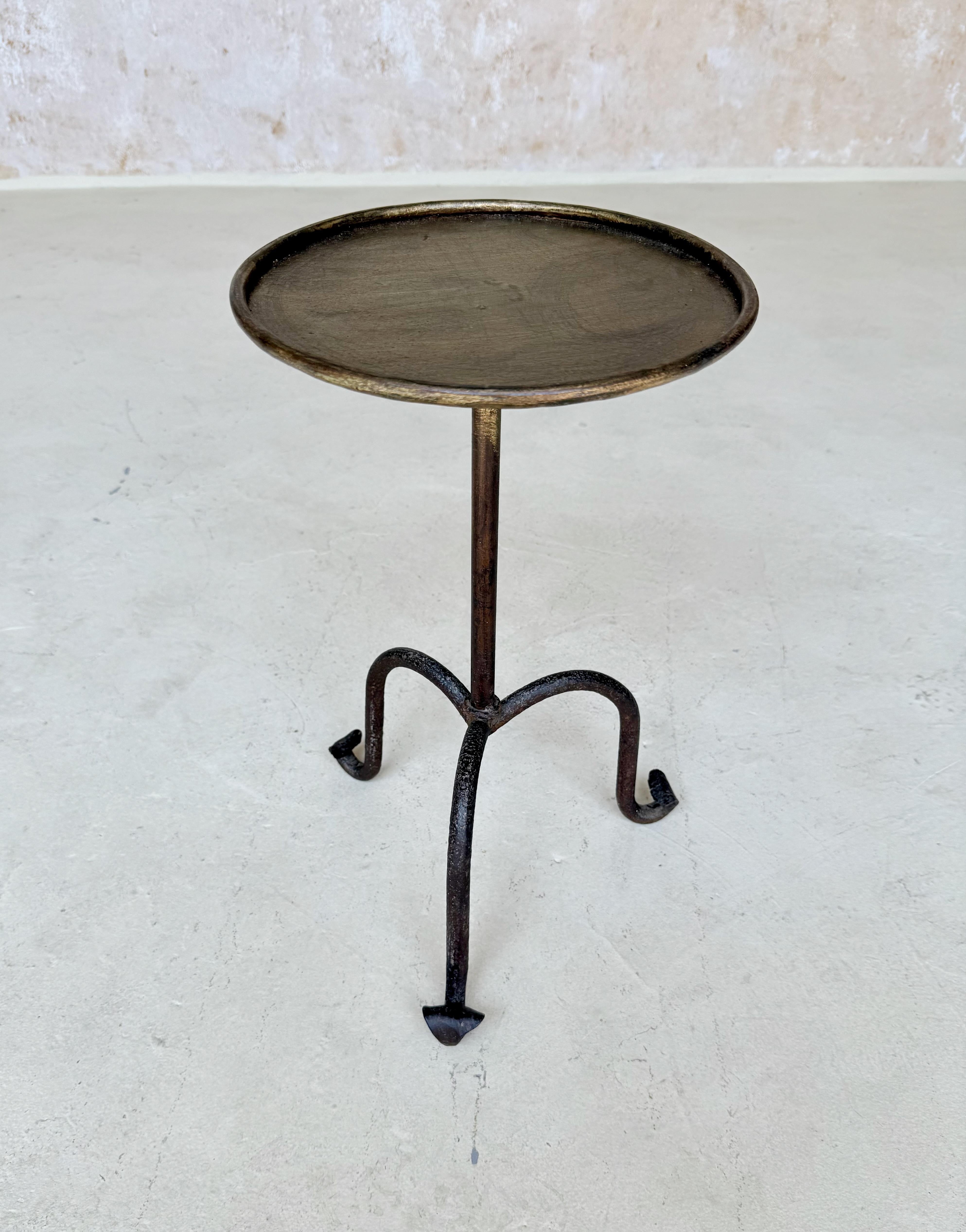  Vintage-Inspired Spanish Iron Drinks Table 

Charming vintage-inspired iron drinks table recently  hand-crafted in Spain using time-honored techniques. This small scale side table features an elevated tripod base with gracefully scrolled feet and a