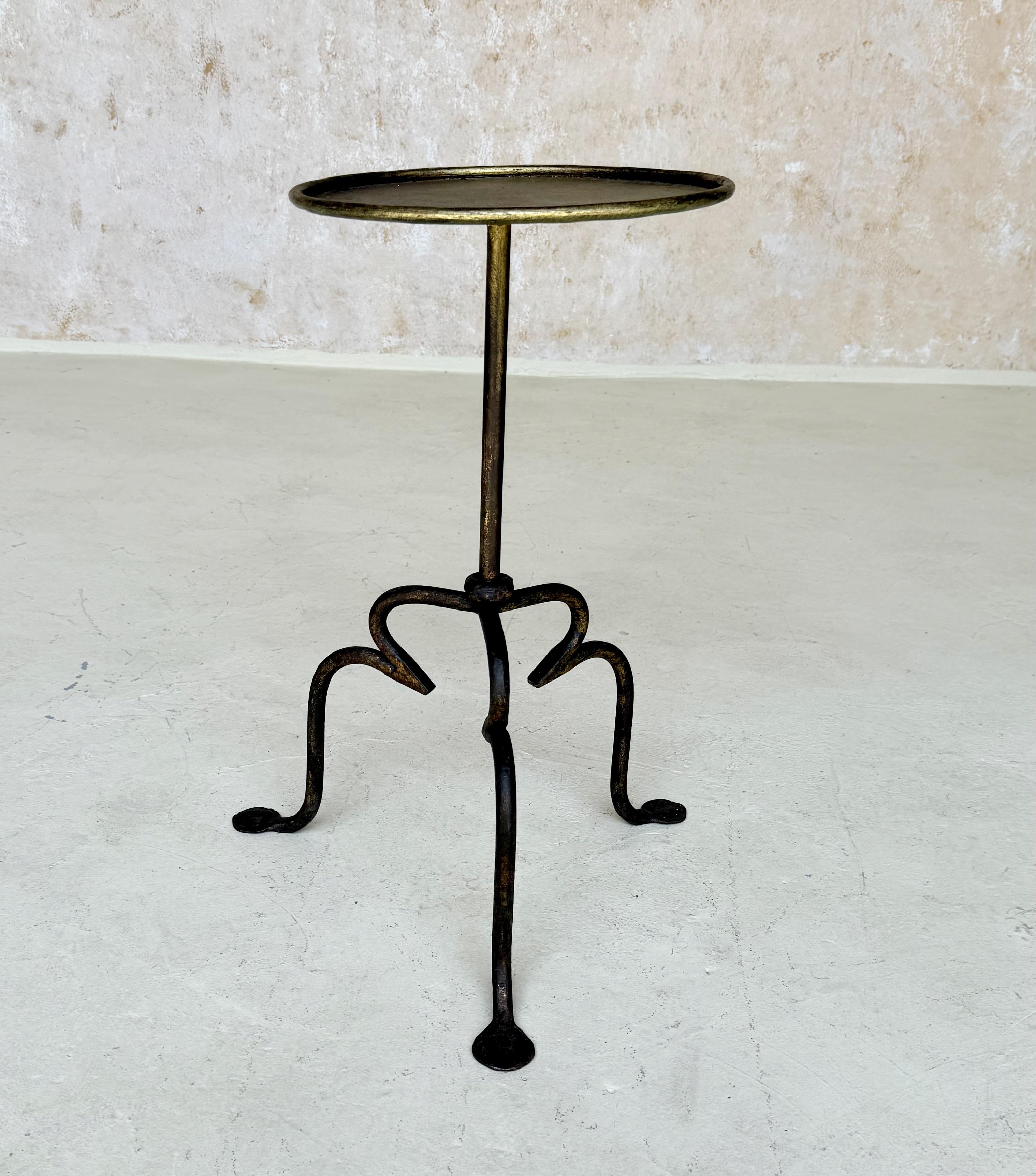 Vintage-Inspired Spanish Iron Drinks Table on a Tripod Base 


This charming drinks table was recently hand-crafted by skilled European artisans using traditional iron working techniques.  It features a central stem with a decorative ring detail