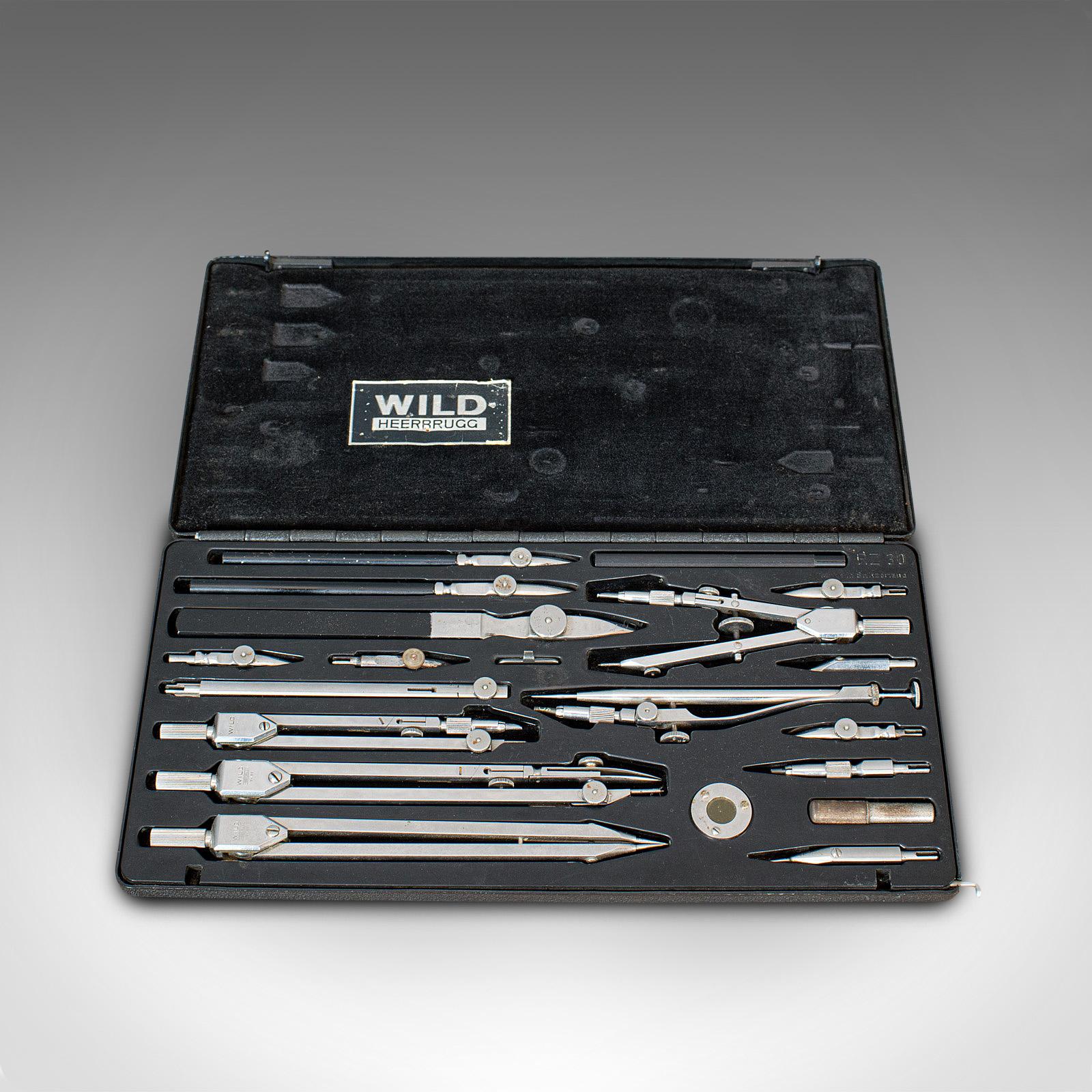 This is a vintage instrument set. A Swiss, chromium steel precision technical drawing case by Wild Heerbrugg, dating to the mid-20th century, circa 1970.

Striking, high quality Swiss instruments
Displaying a desirable aged patina
Chromium steel