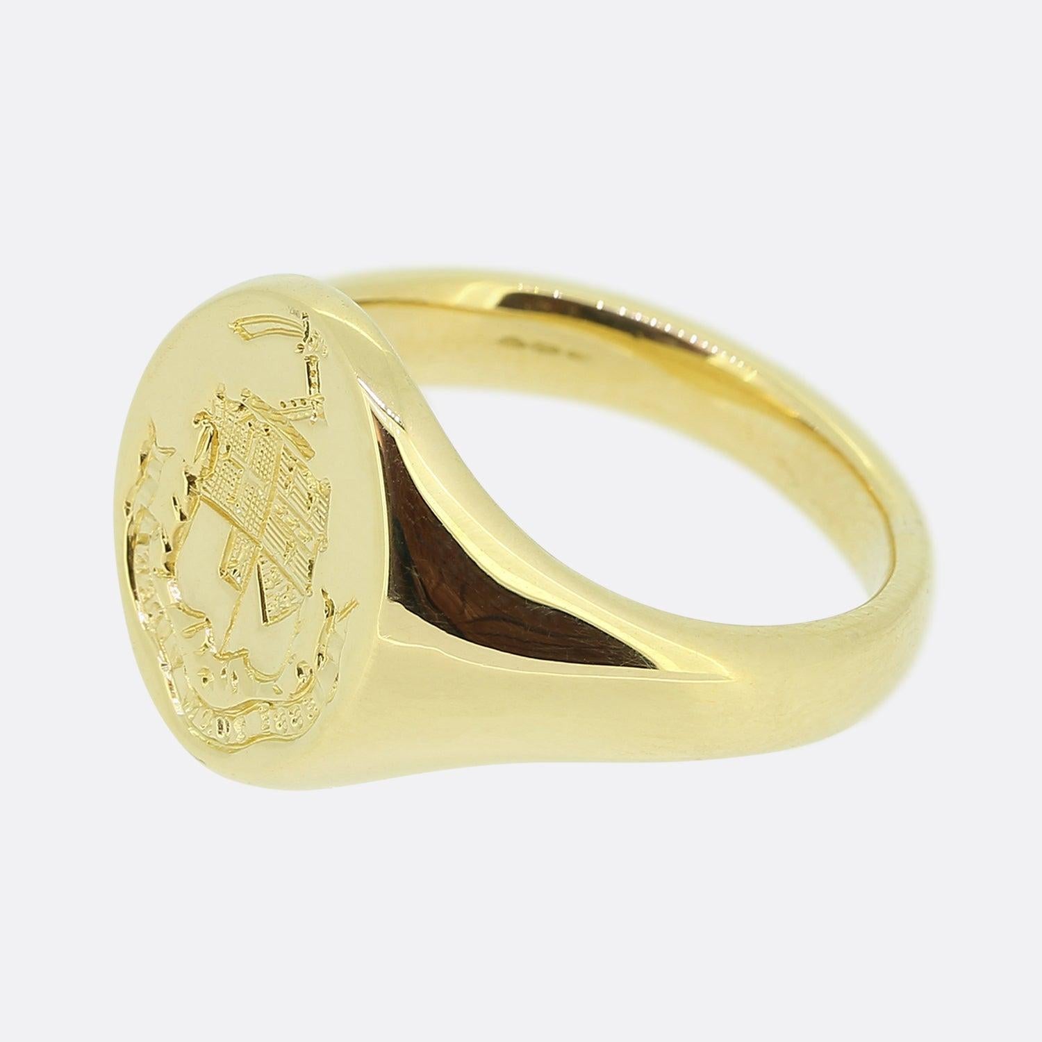 Here we have a vintage 18ct yellow gold signet ring. This oval shaped piece showcases a finely detailed deep intaglio of a coat of arms featuring a family emblem with a sword lifted aloft. The ring weighs an impressive 16.9 grams and features the