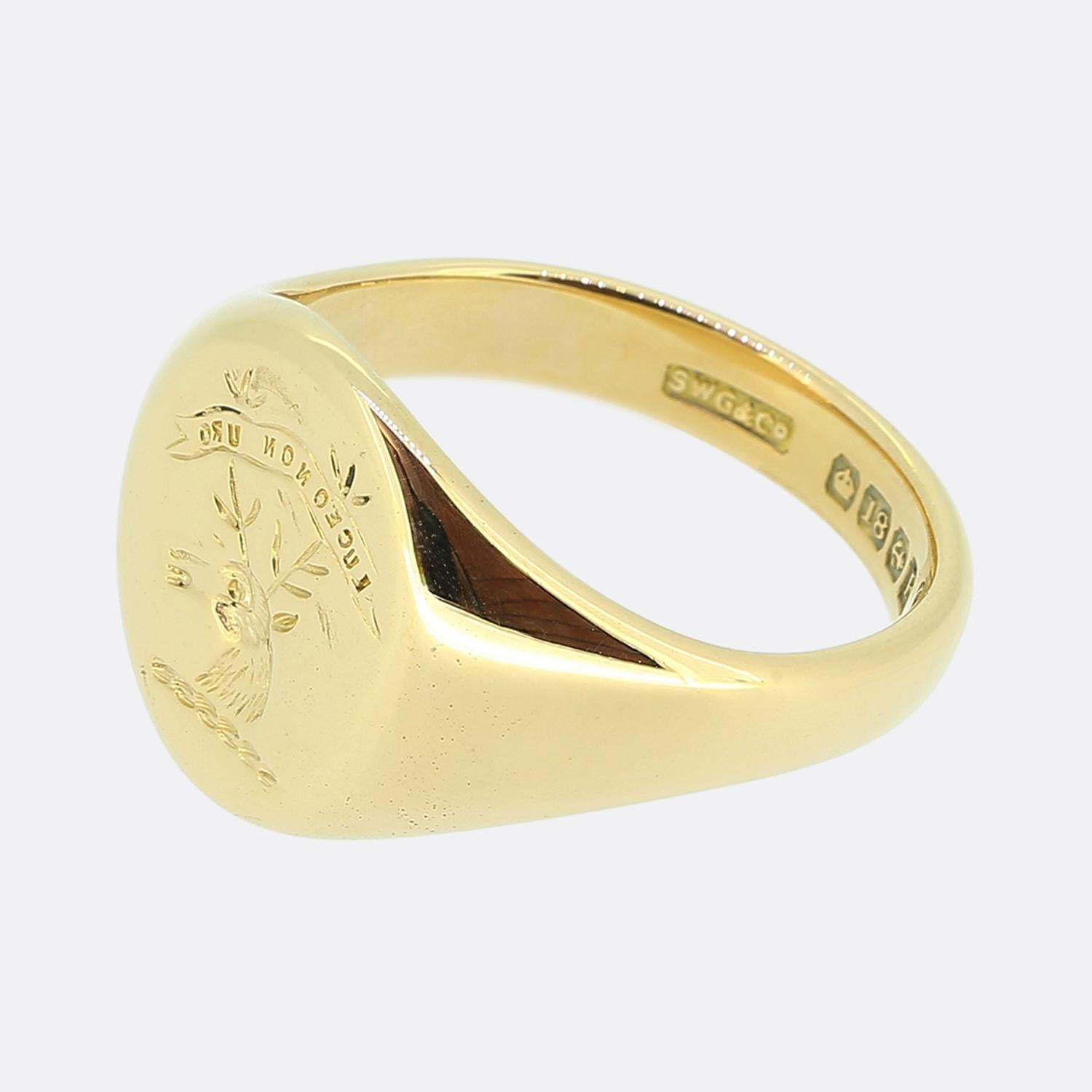 Here we have an 18ct yellow gold oval shaped signet ring. This vintage piece showcases a finely detailed deep intaglio of the head of a stag. 

Above the main design the words read 'LUCEO NON URO' which translates from Latin into English as 'I