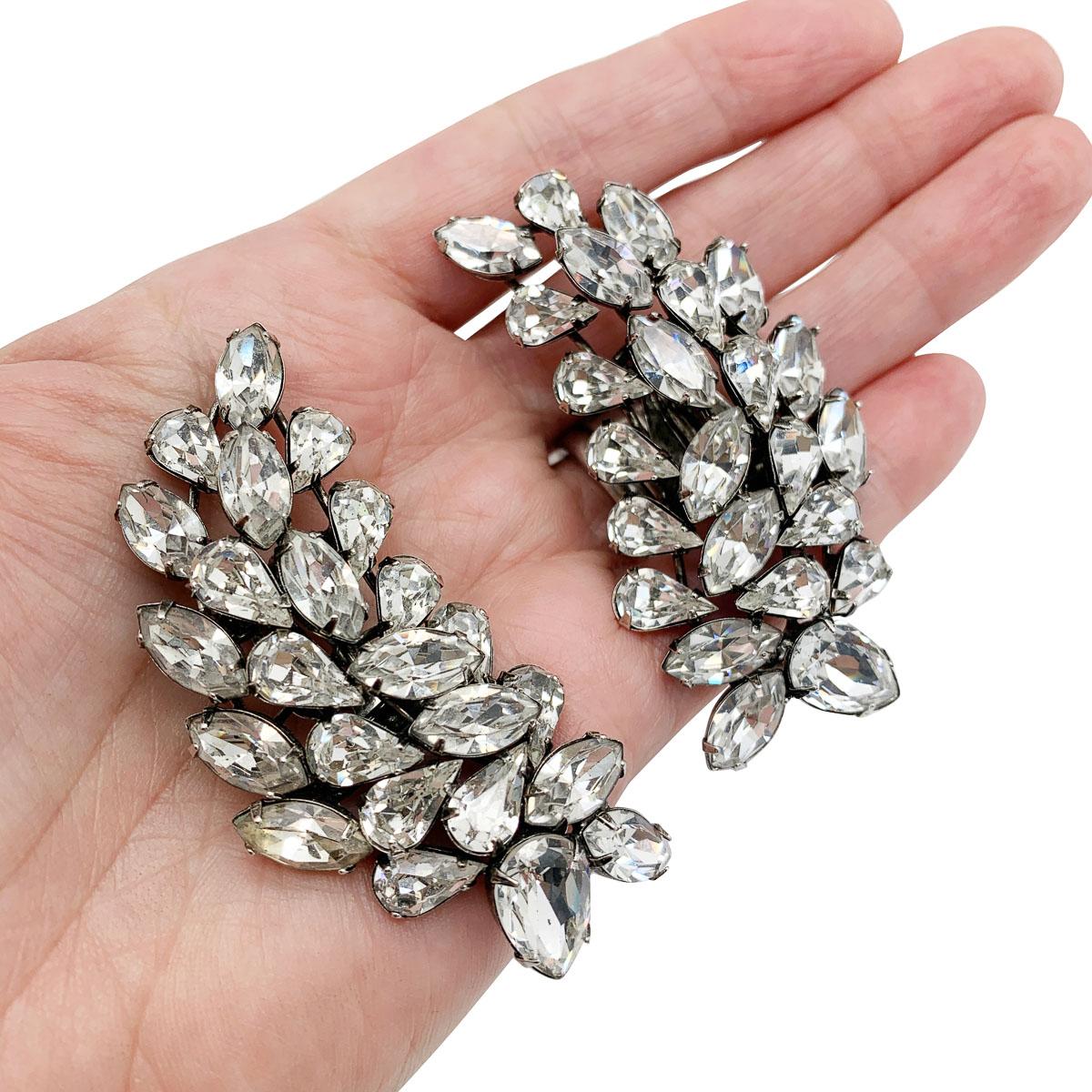 The most spectacular pair of Vintage Iradj Moini Ear climbers. Boasting a huge array of large fancy stones in pear and marquise cuts framing the face to perfection with their huge sweep. Each stone claw set.

Vintage Condition: Very good without