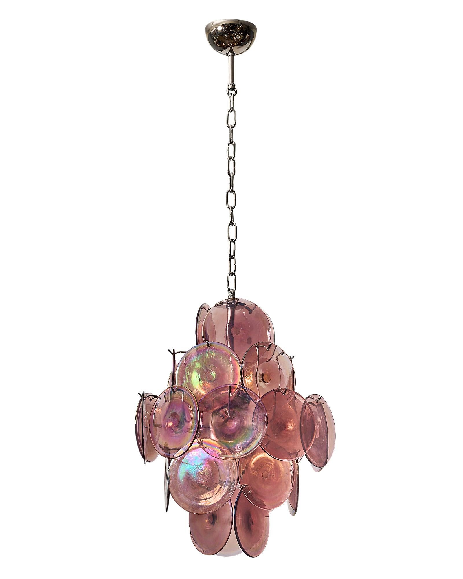 Italian Murano glass discs chandelier by Carlo Nason. A collection of Murano Iridescent Amethyst glass discs on a chromed steel structure. This chandelier features 27 glass discs.