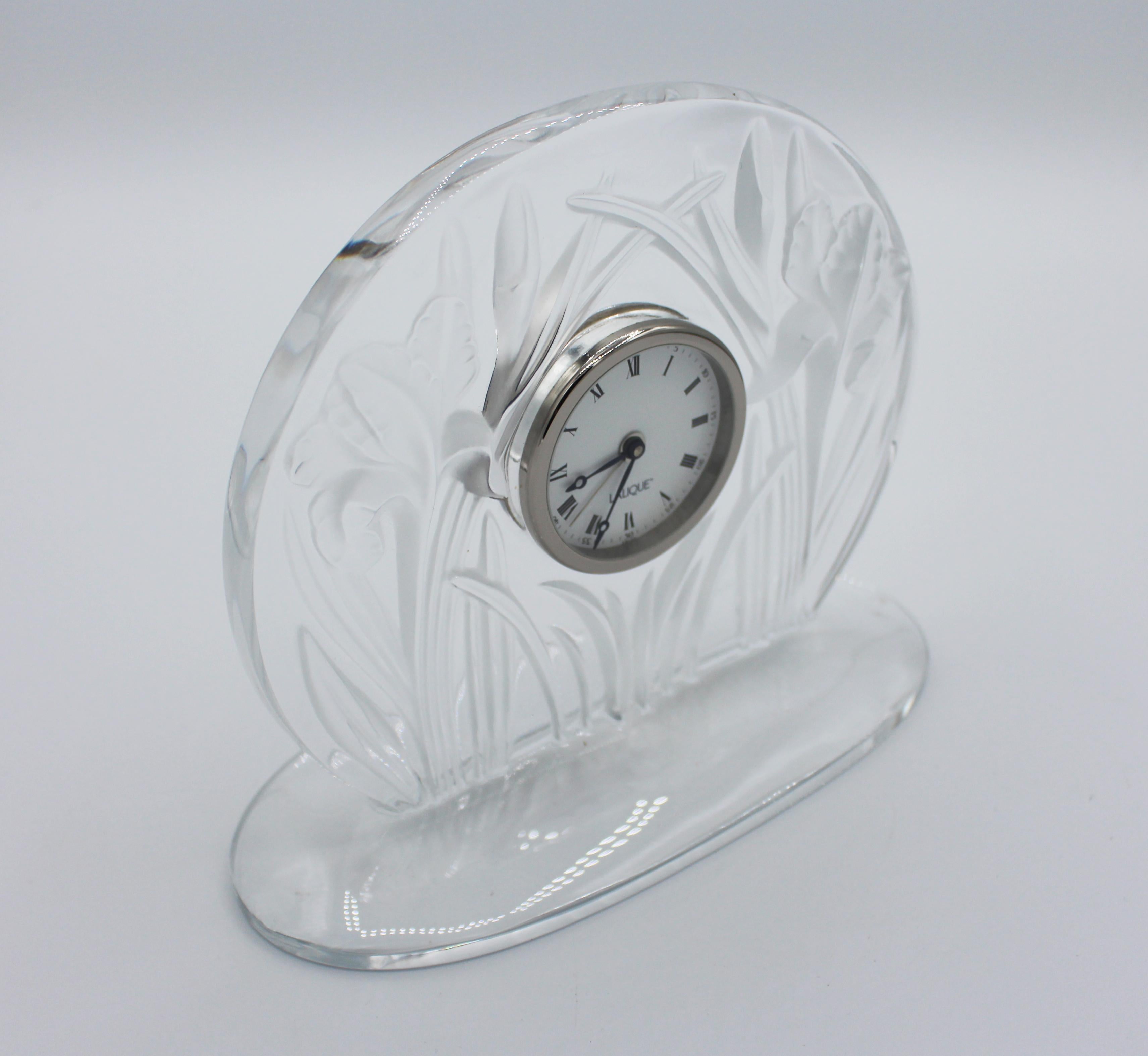 The Iris table clock by Lalique. Frosted and clear glass create a remarkable piece of art glass. Quartz movement. 7